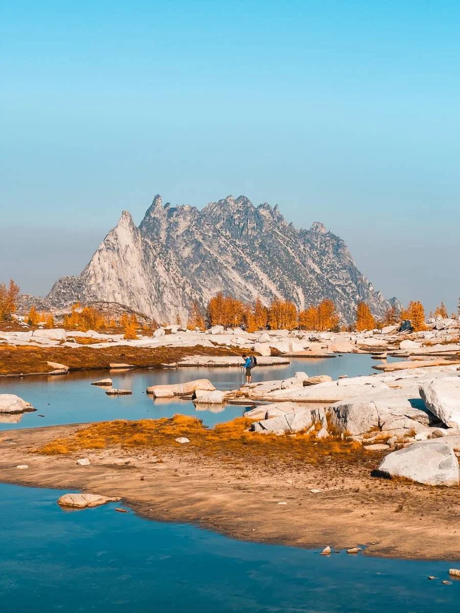  Hiker traversing the Core Enchantments route on a clear day 