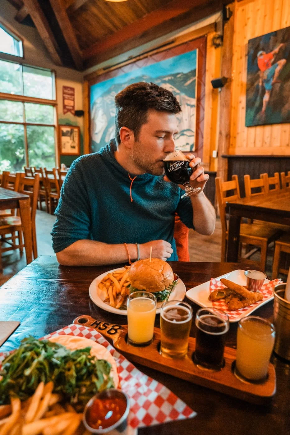 man enjoying food and drink at Howe Sound Brewing