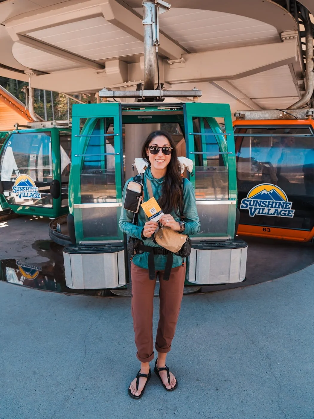 Girl about to board the sunshine village gondola with her ticket