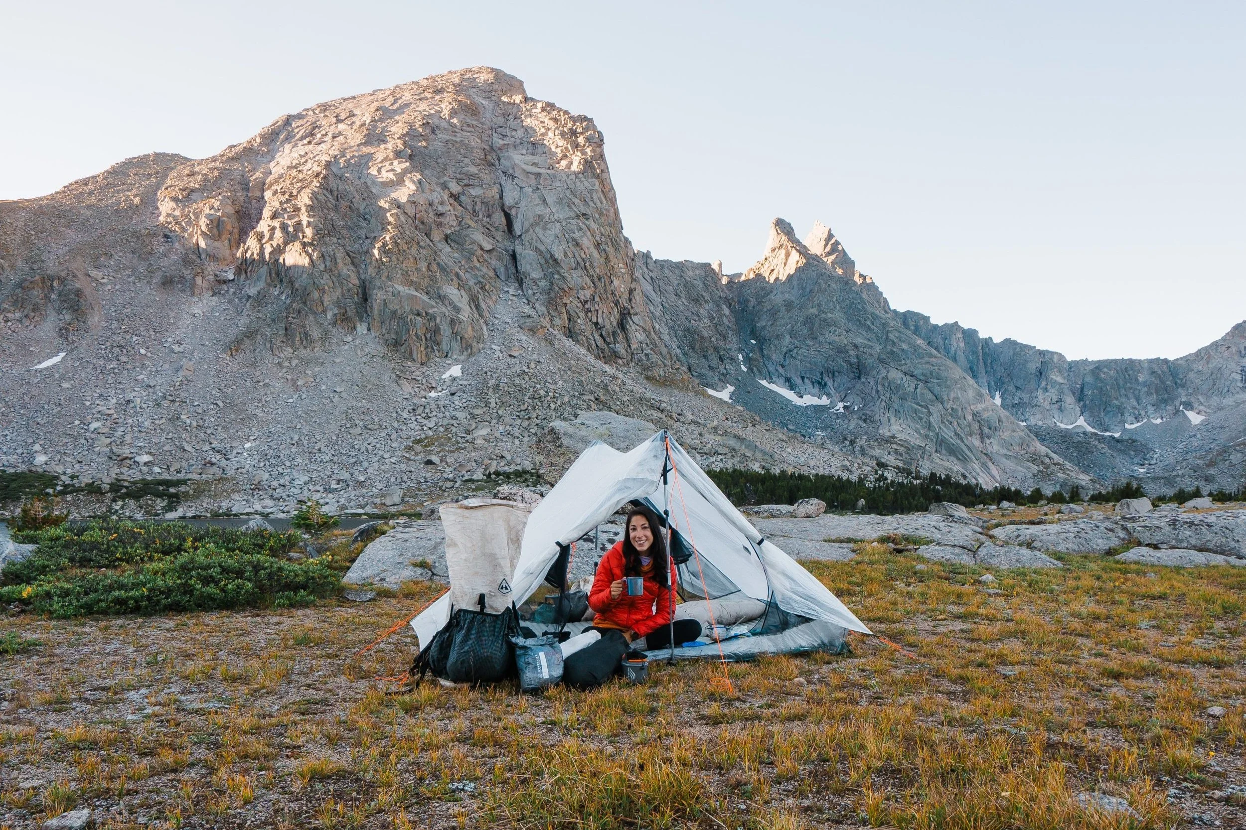 girl sitting in Hyperlite Unbound 2 tent in wind river range wyoming