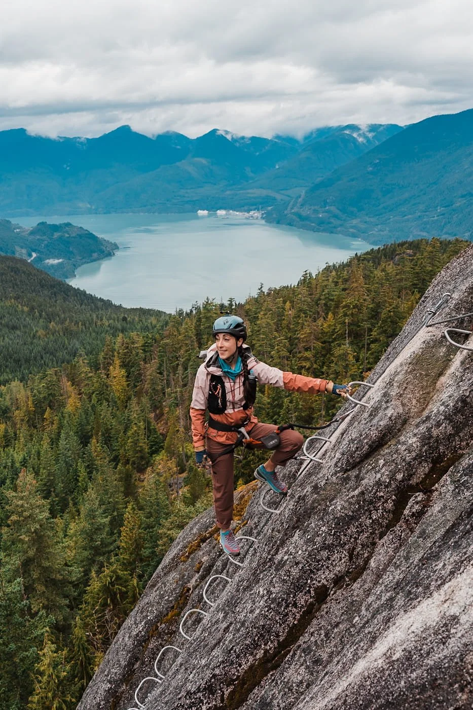 Girl on ladder along the Squamish Via Ferrata