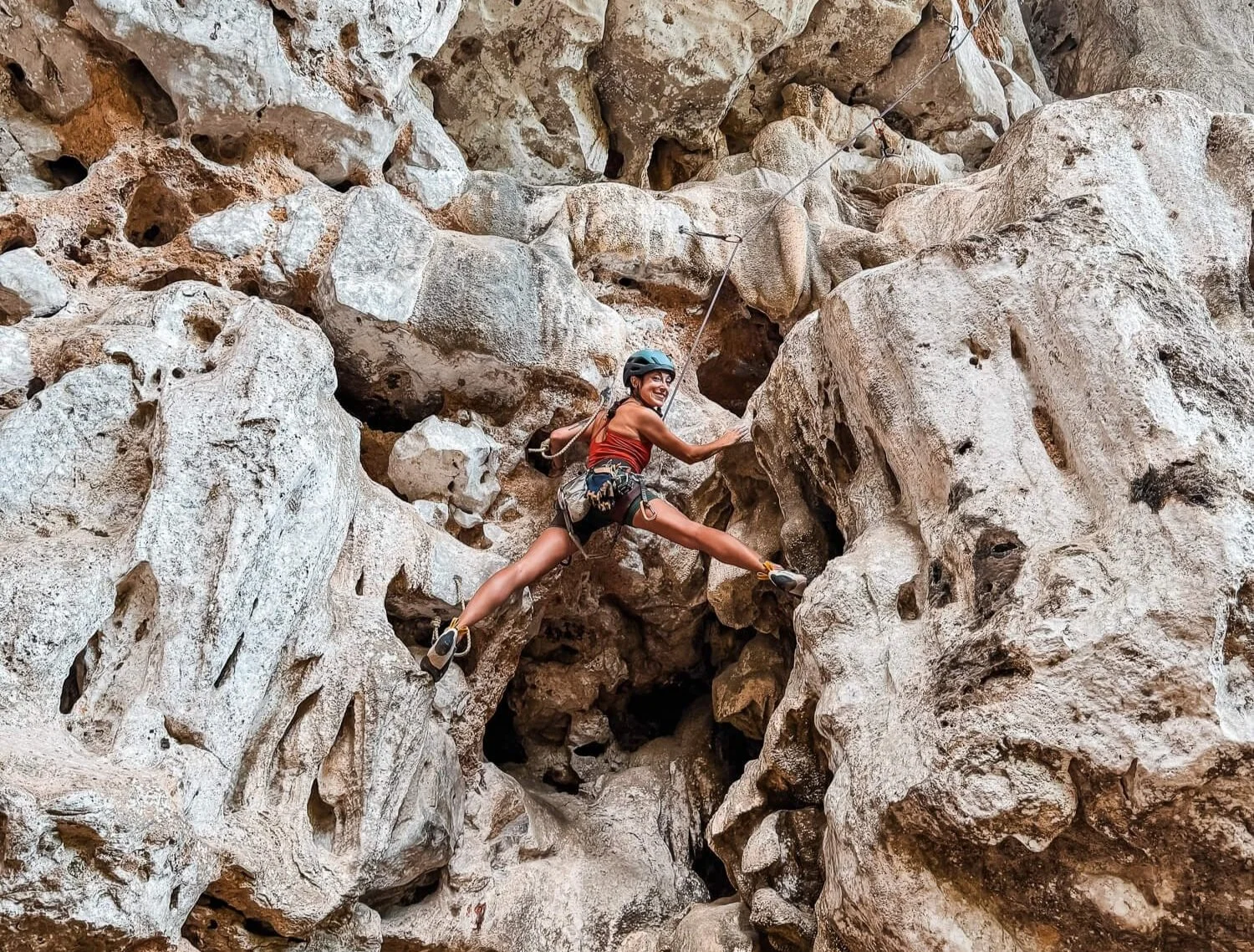 girl rock climbing in ao nang thailand