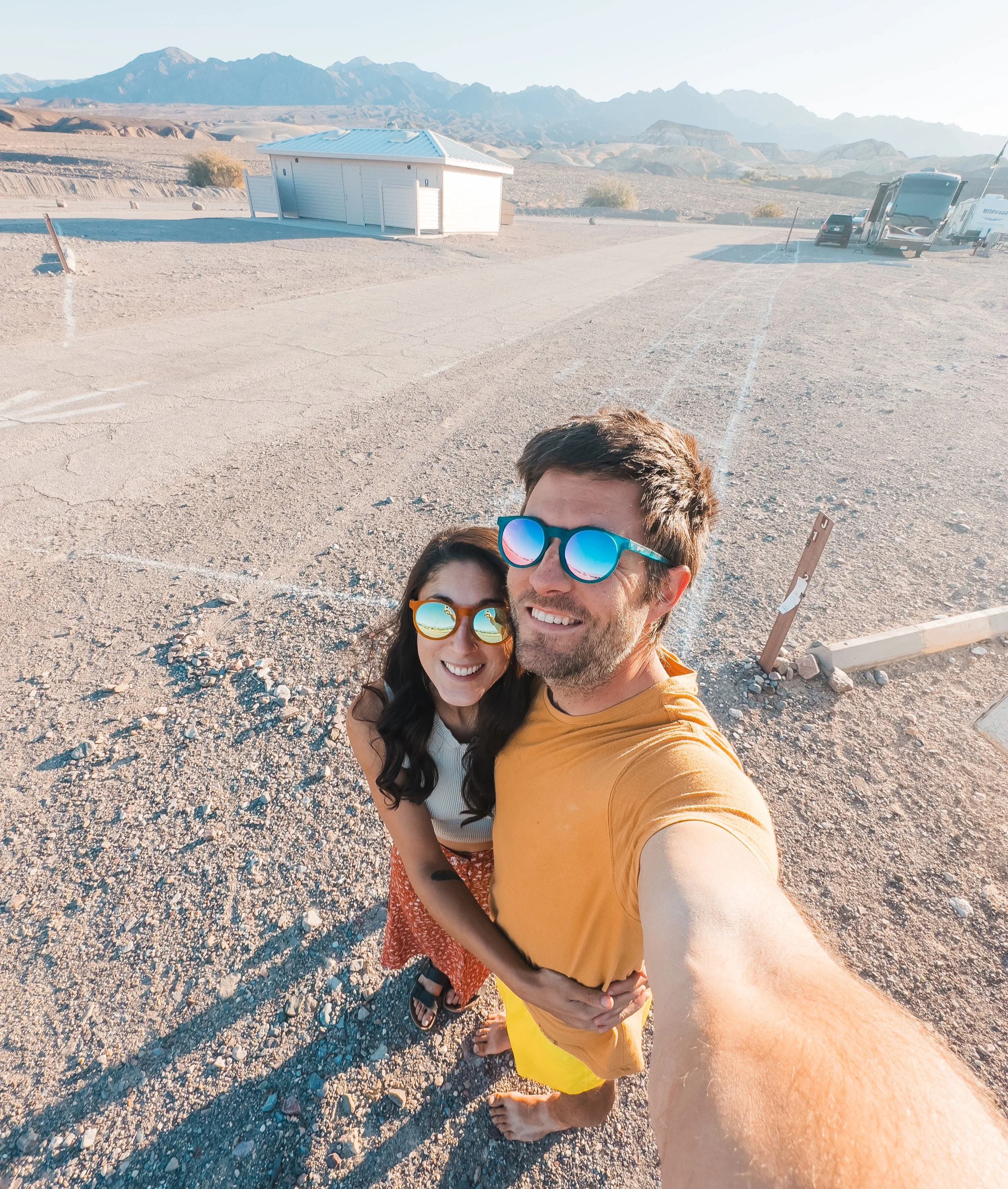 a couple taking a selfie at a campground in death valley