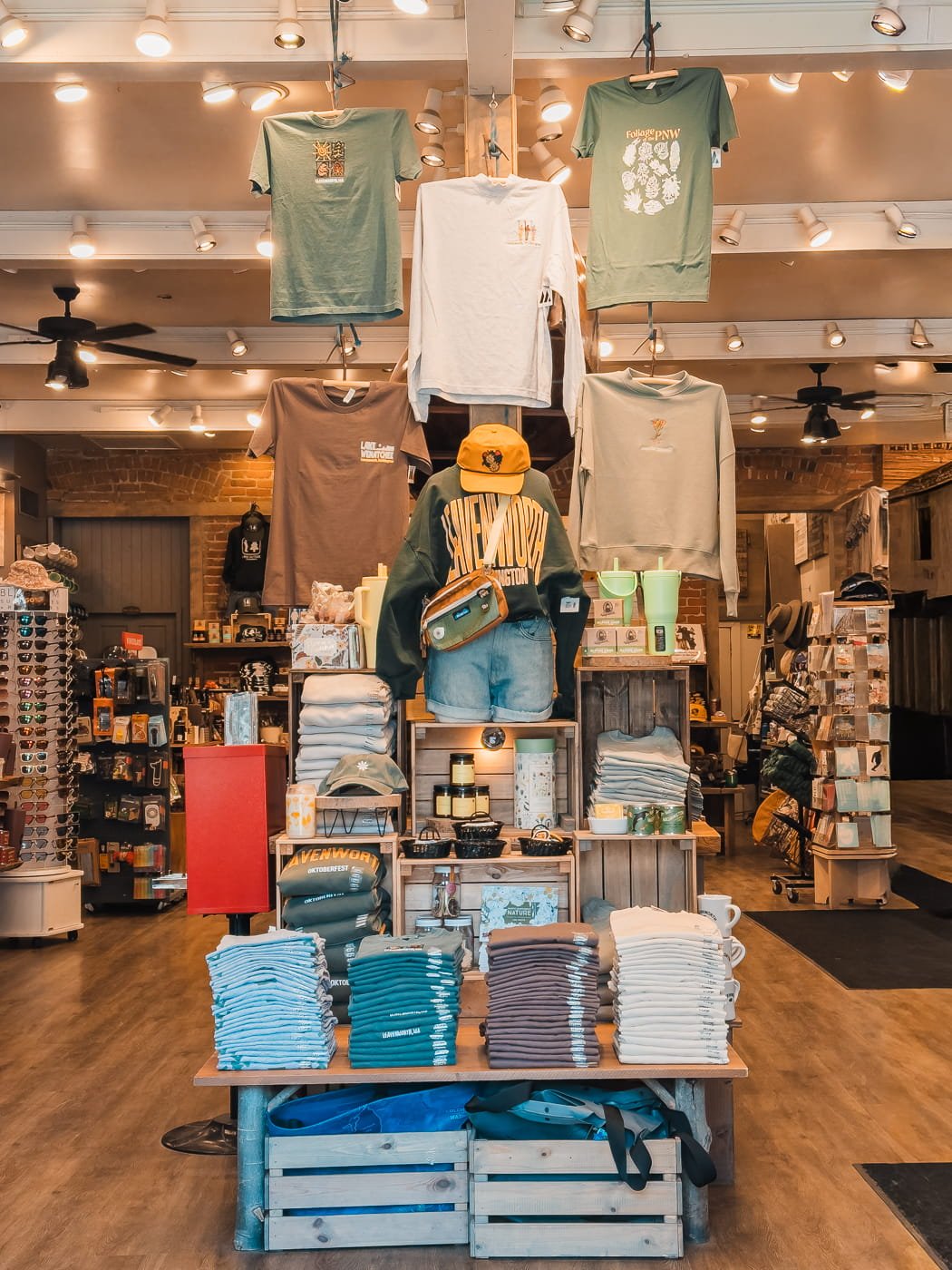 Merchandise display of shirts and books
