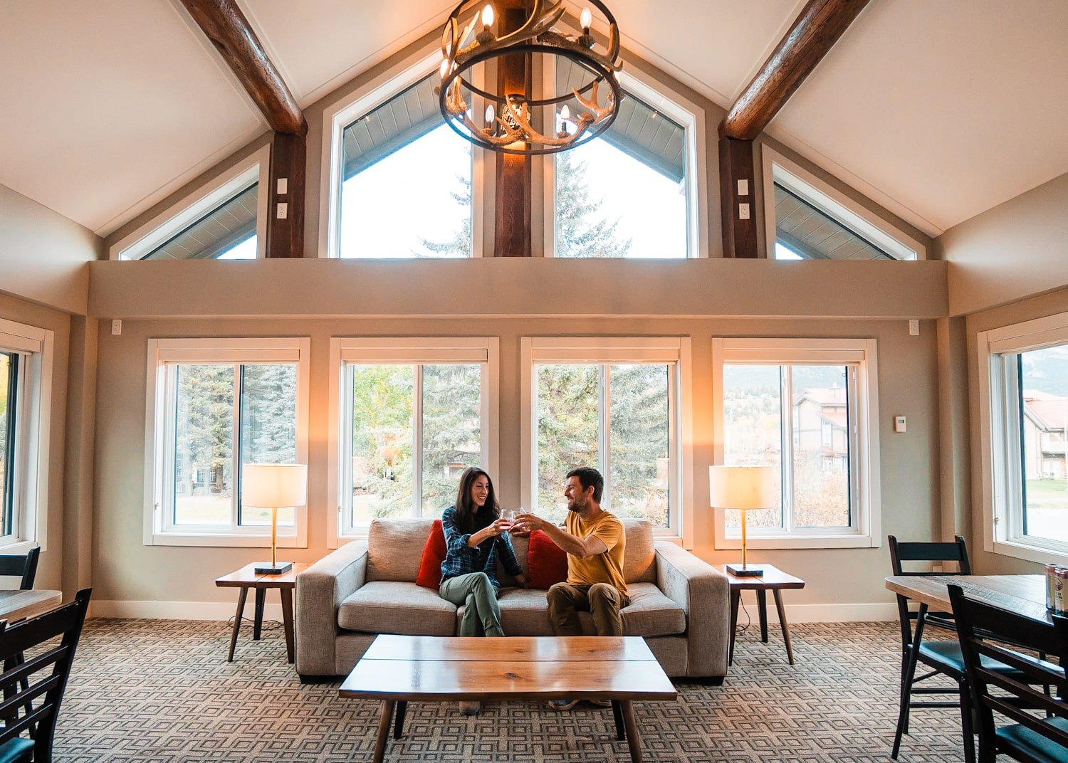A couple sitting inside of a hotel with drinks
