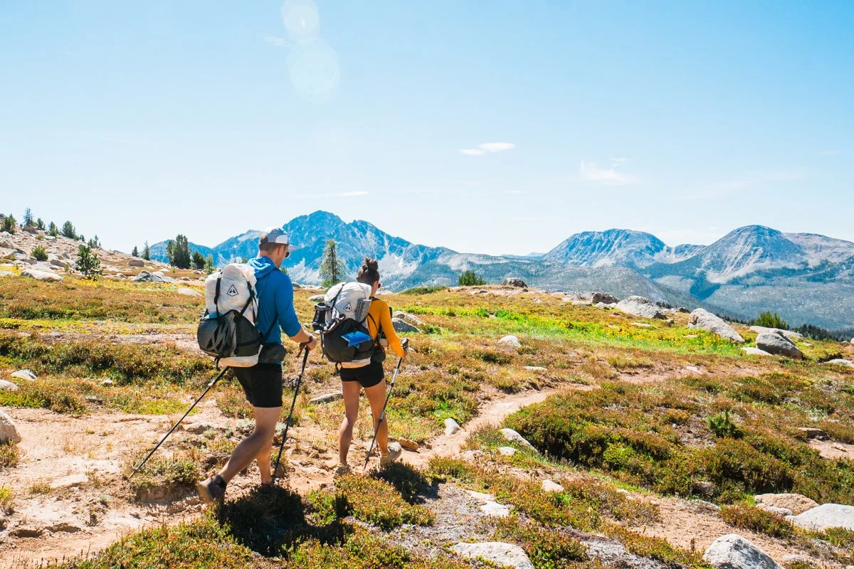 backpackers descending amphitheater mountain along a trail in the pasayten wilderness