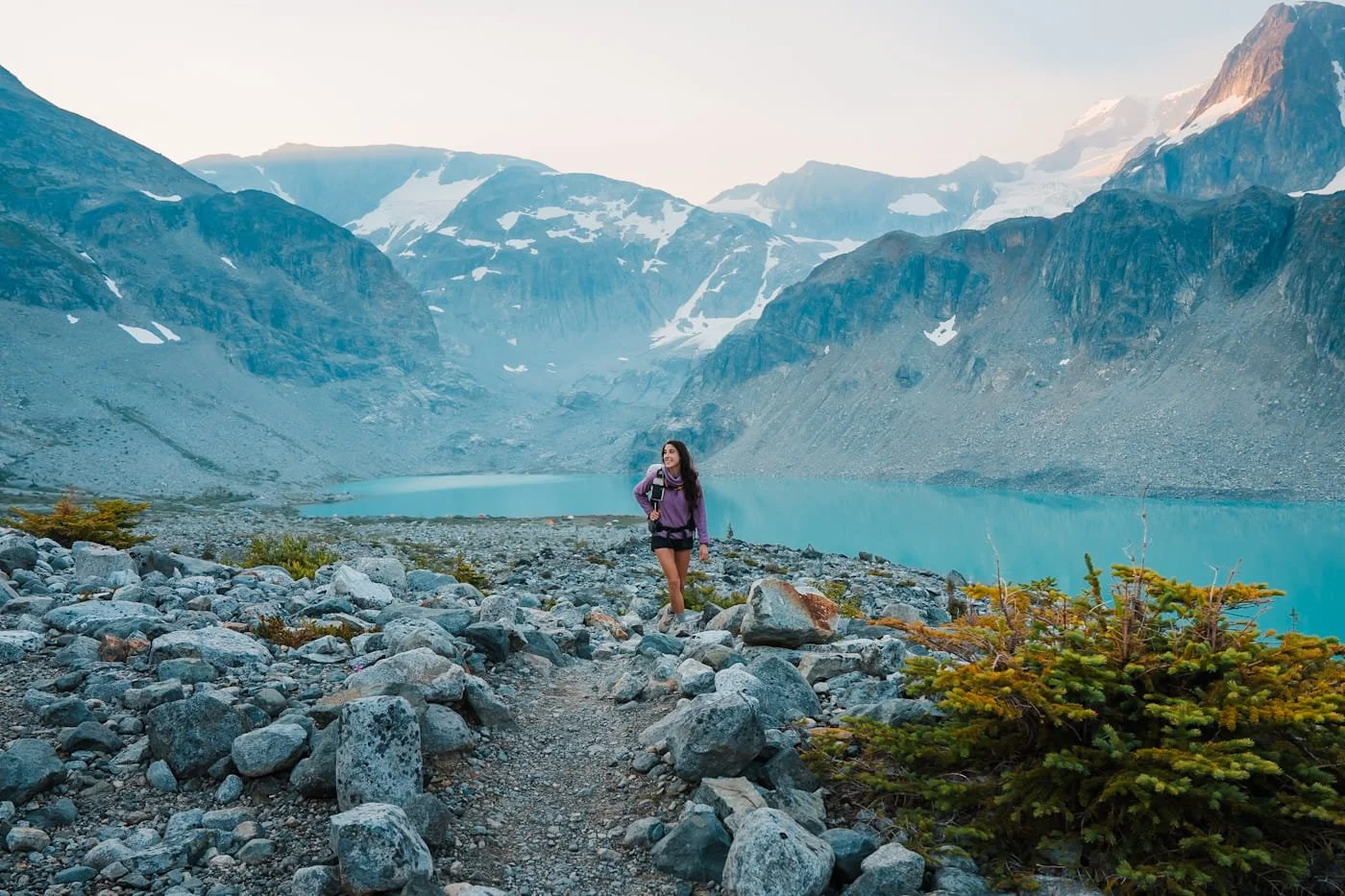 Girl walking on rocky path above Wedgemount Lake in Garabaldi Provincial Park