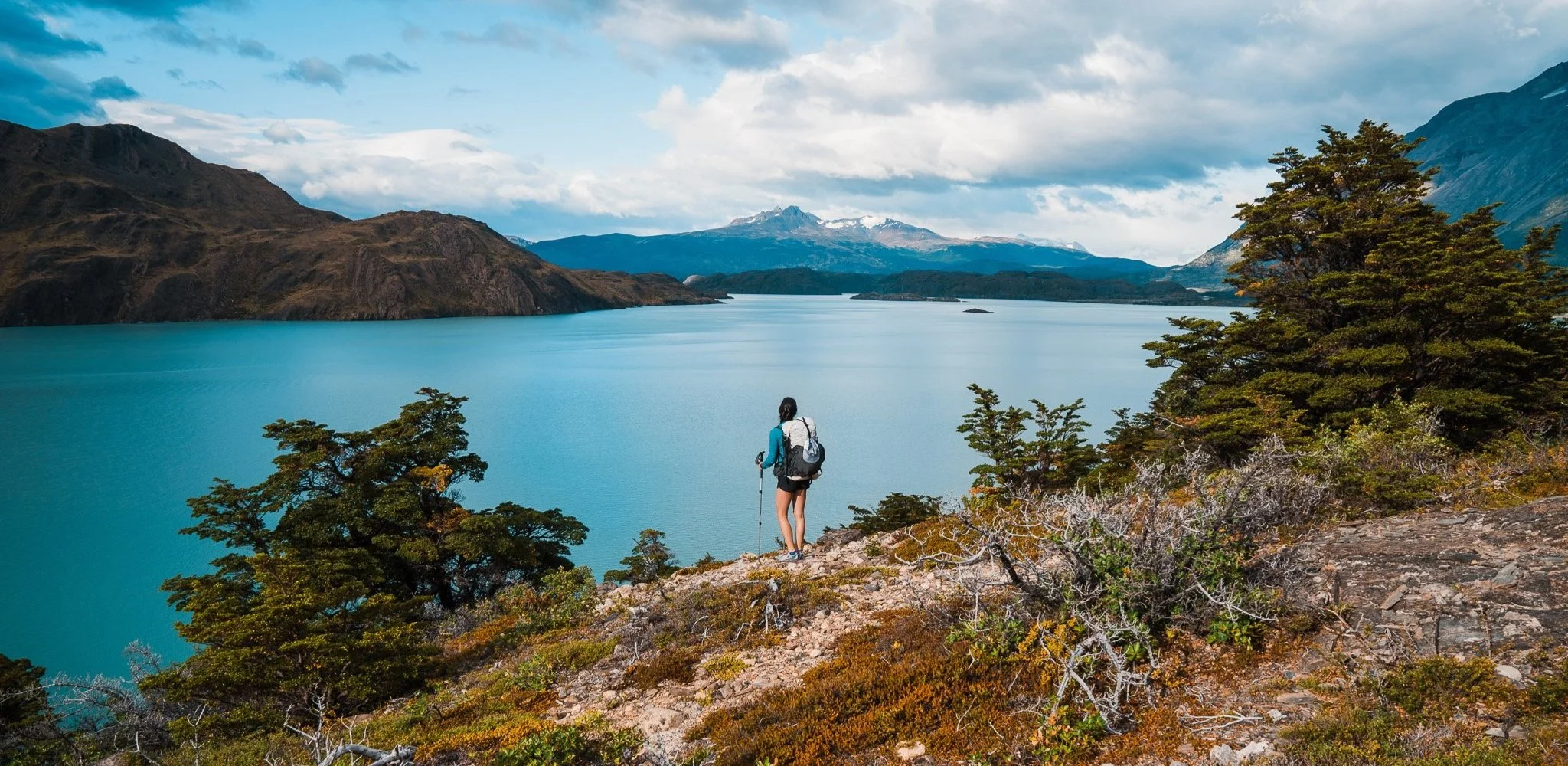 girl on a backpacking trail looking out into the distance in patagonia