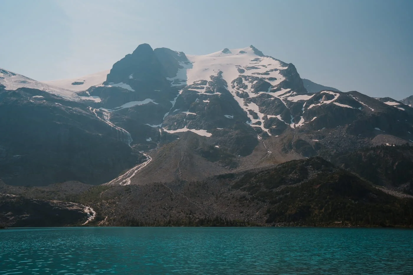 looking across a Upper Joffre lake at a glaciated mountain peak