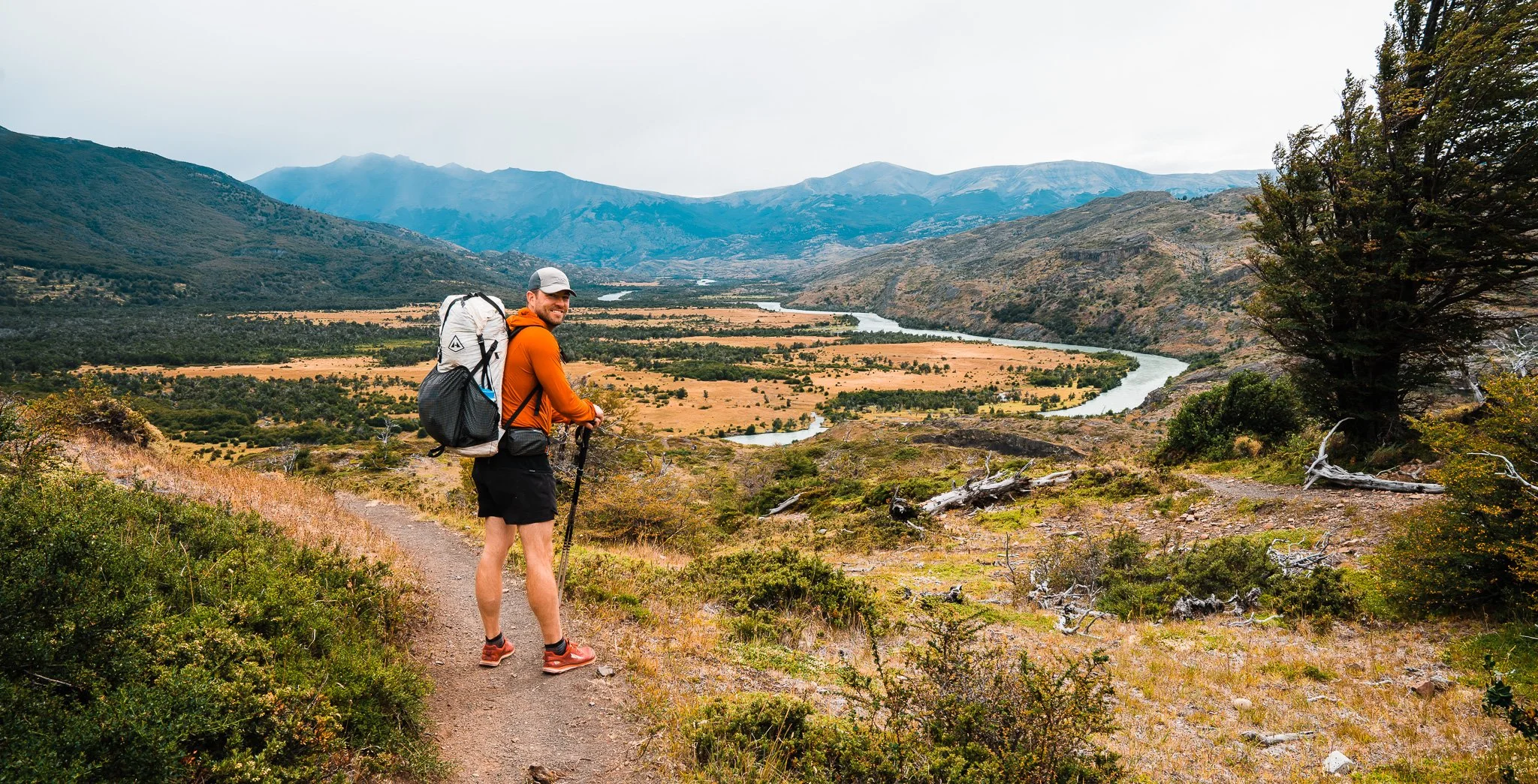 man overlooking rio paine