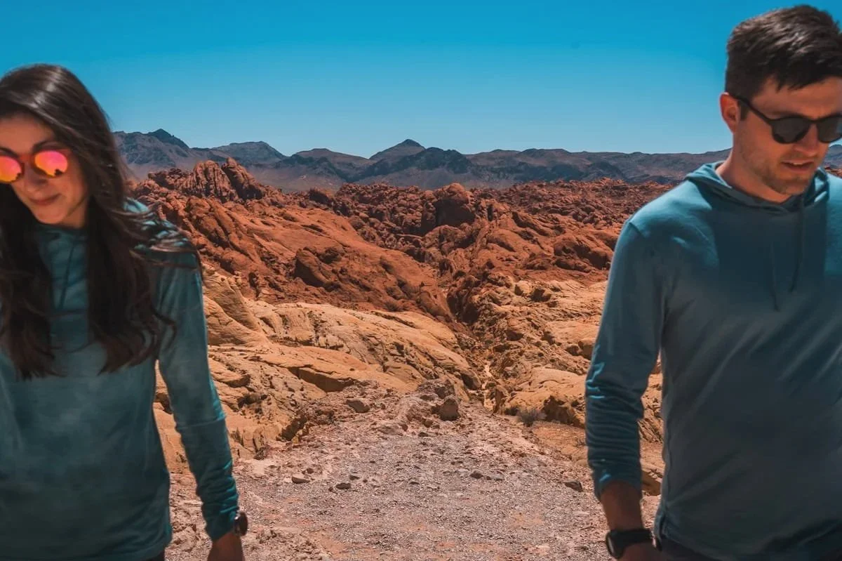 man and woman hiking in valley of fire nevada