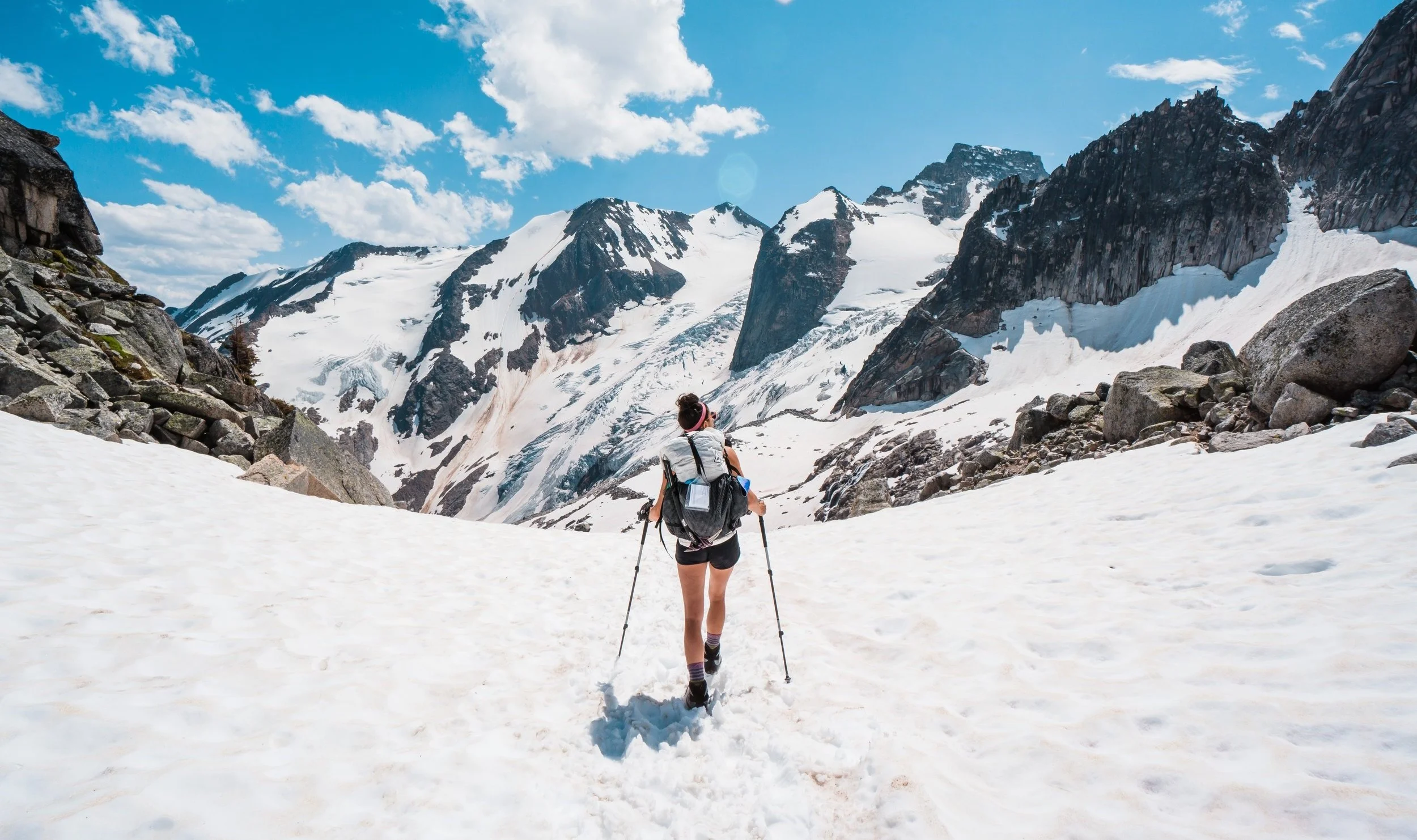 girl backpacking in high glacial alpine of the bugaboos in British Columbia Canada