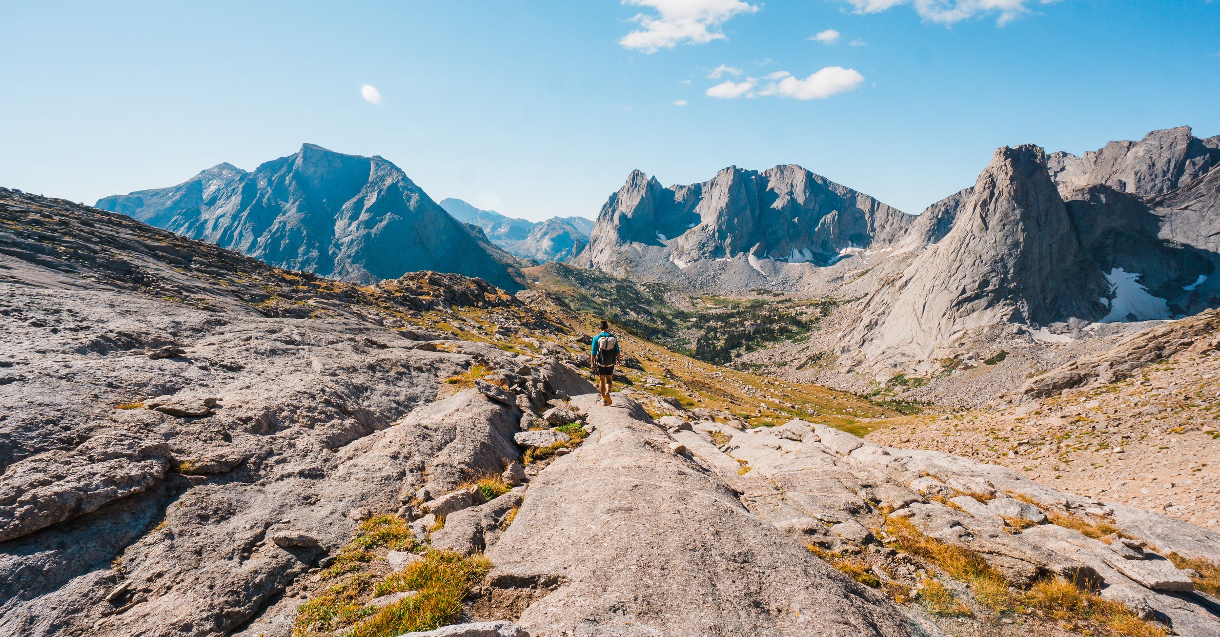 Heading down from mountain pass to cirque of the towers in wind river range wyoming