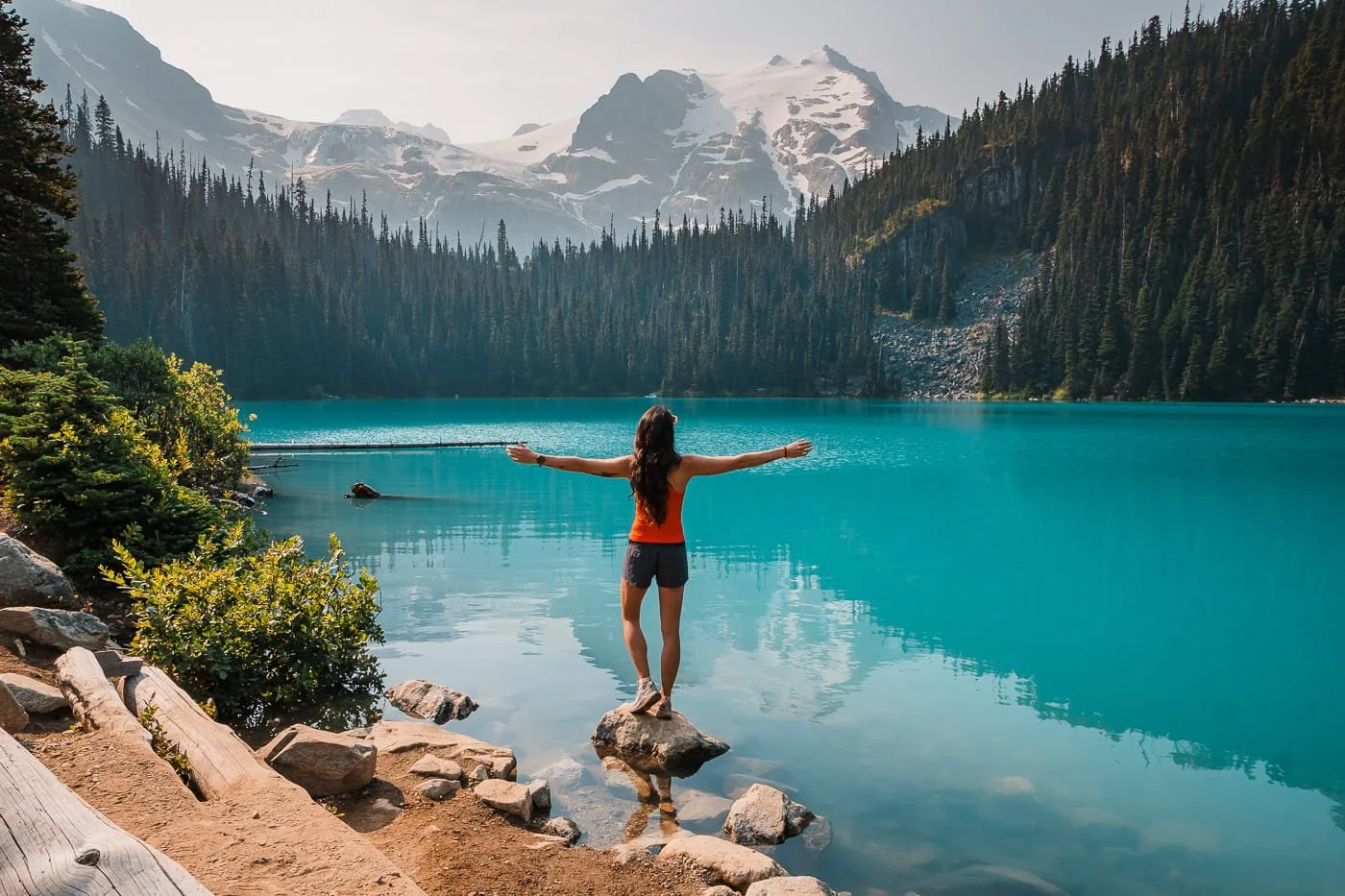 girl standing on rock at middle Joffre Lake