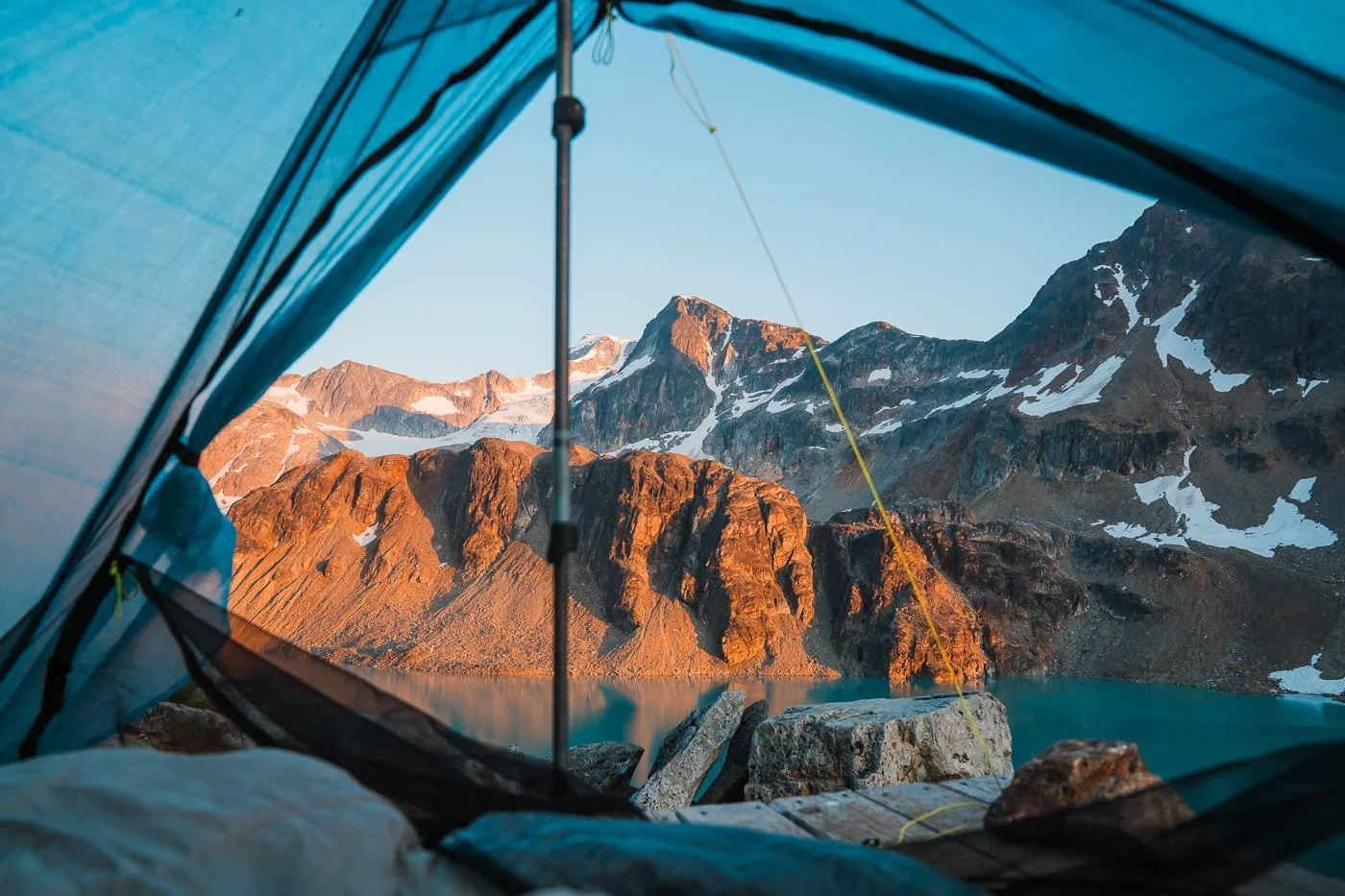 tent door view of wedgemount lake at sunset
