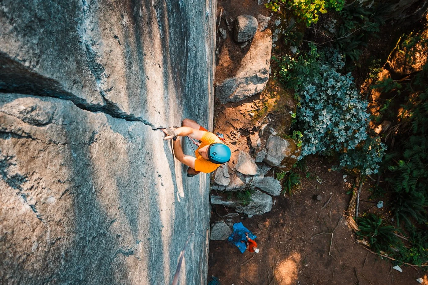 rock climber climbing up a vertical crack near Squamish bc