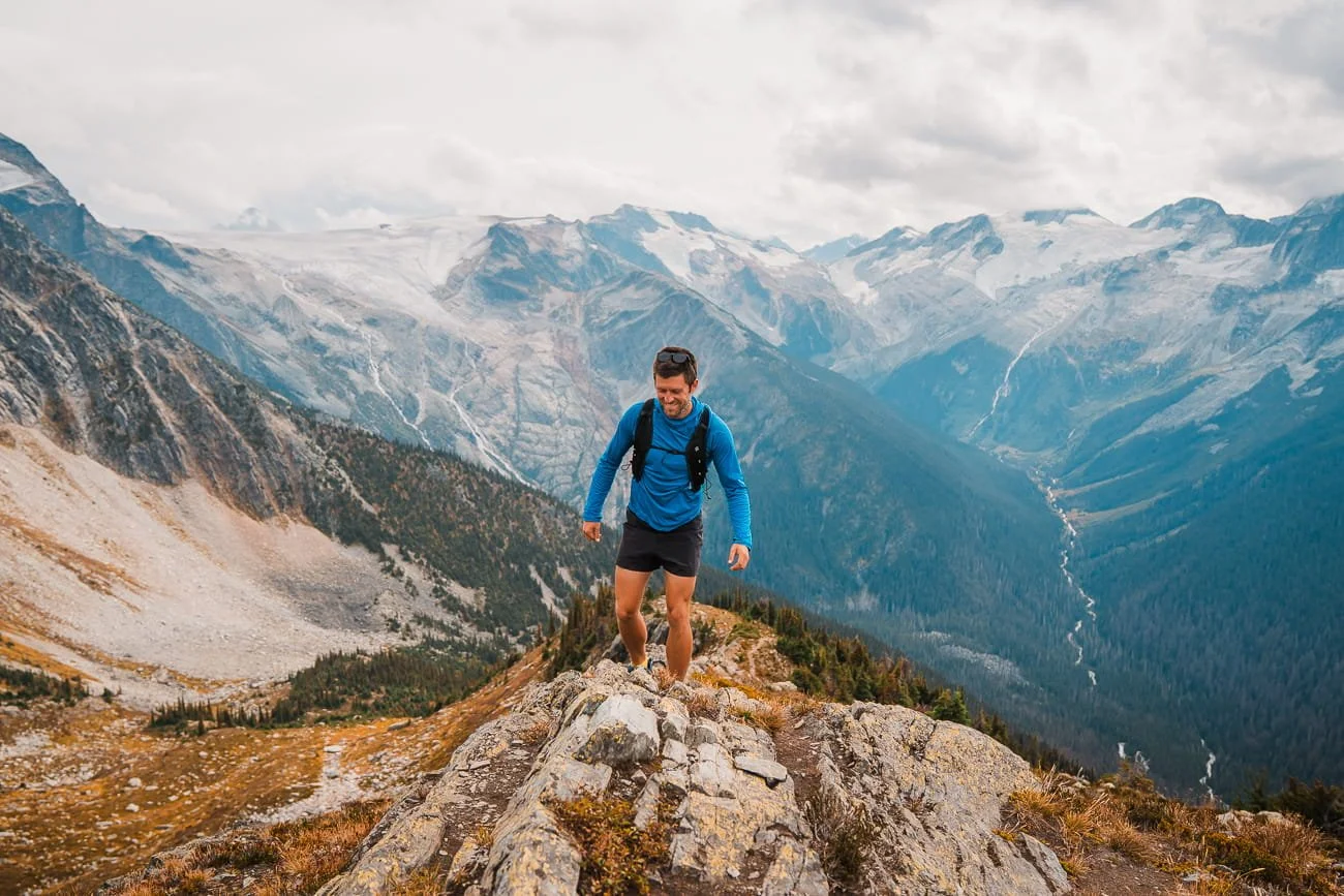 Man hiking up ridgeline in Glacier National Park Canada