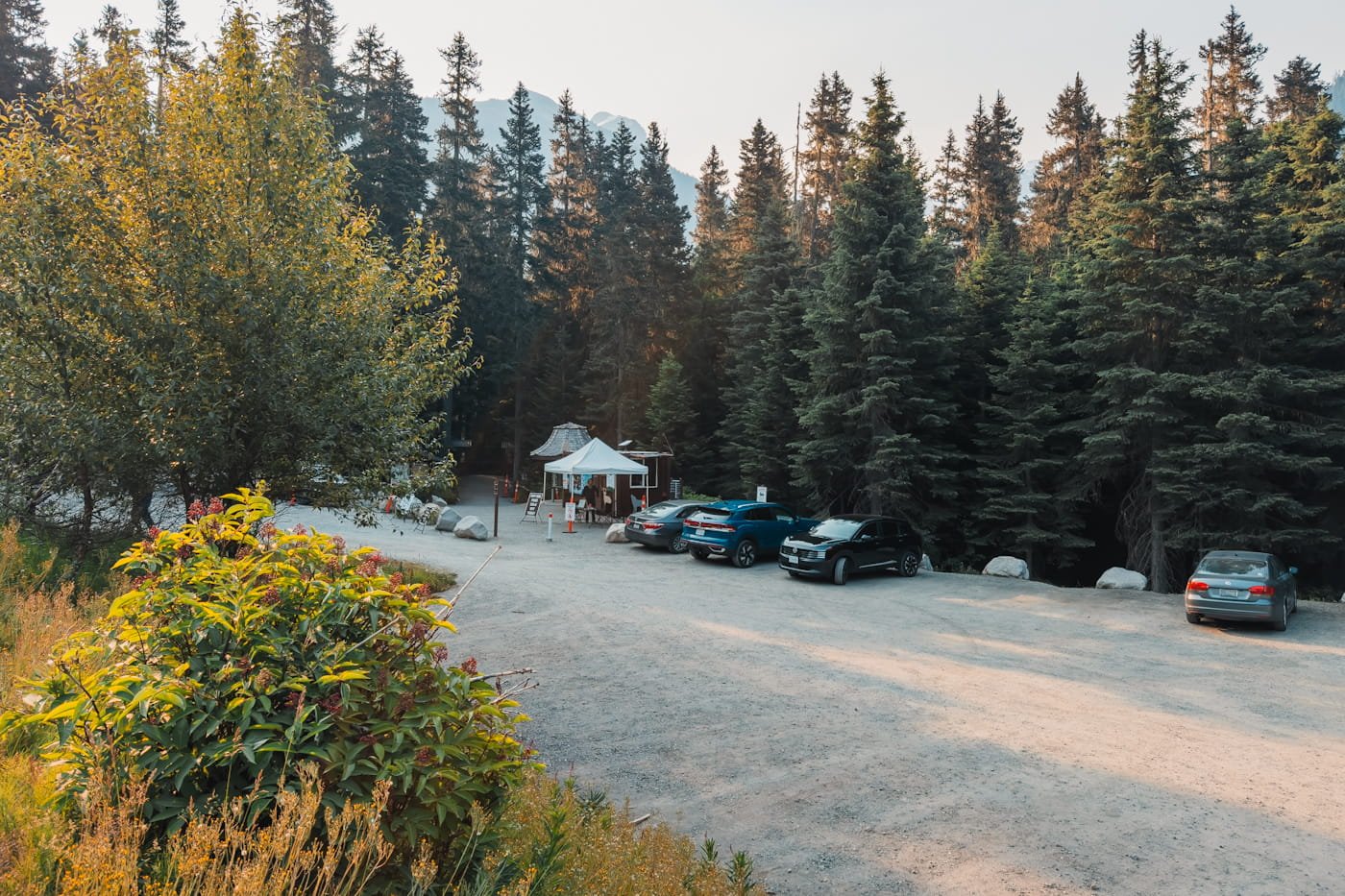 the gravel parking lot at the joffre lakes trailhead