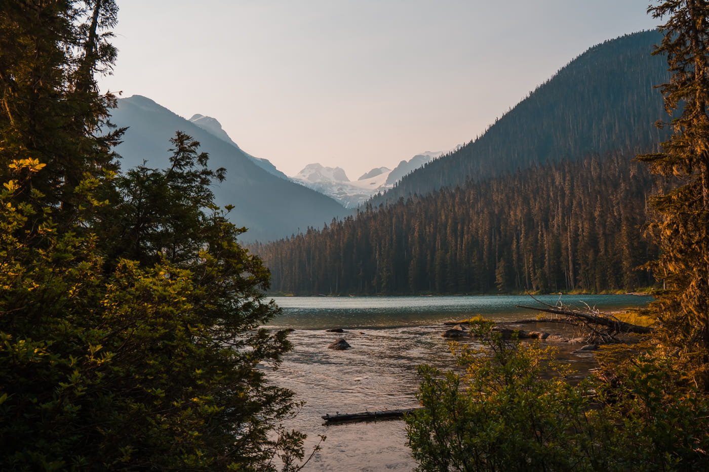 looking out at lower Joffre lake with some trees and mountains in the background