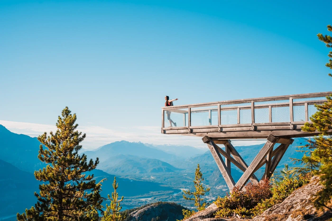 Girl standing on the Chief Overlook viewpoint along the Panorama Trail at the Sea to Sky Gondola summit