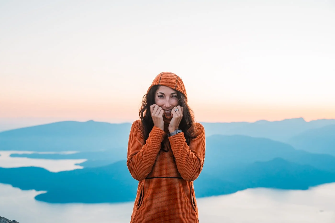 Girl wearing orange melanzan fleece hoodie along the Howe Sound Crest Trail