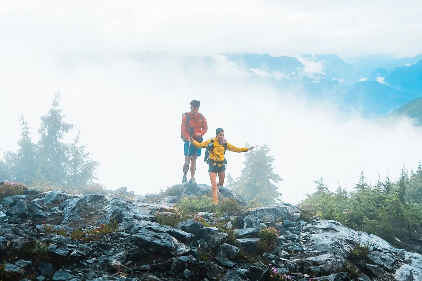 backpacking couple walking through rain and clouds on Panorama Ridge in Golden Ears Provincial Park