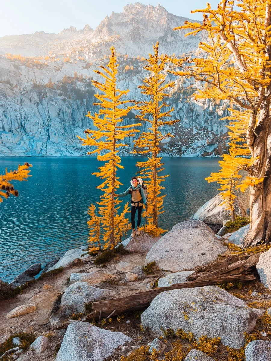  Backpacker climbing Asgard Pass with heavy pack in the Alpine Lakes Wilderness 