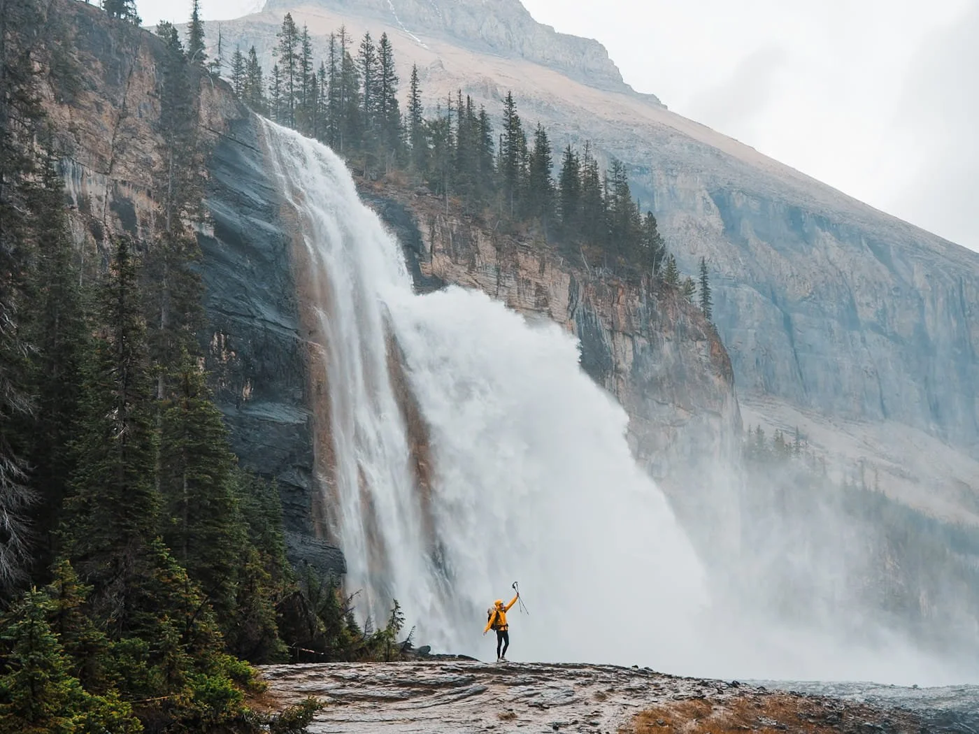 Girl standing in front of Emperor Falls in Mount Robson Provincial Park