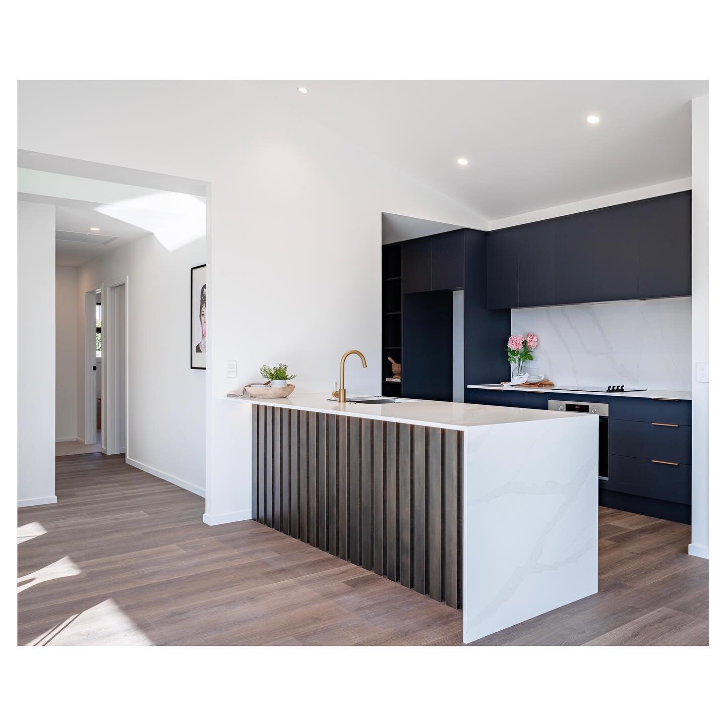 The dark blue almost black finish was perfect for this kitchen. I love that it is bold, but a little softer than black. It is the perfect colour to draw your eye out into the mountains. #interiordesign #kitchendesign #kitcheninspiration #interiordesi