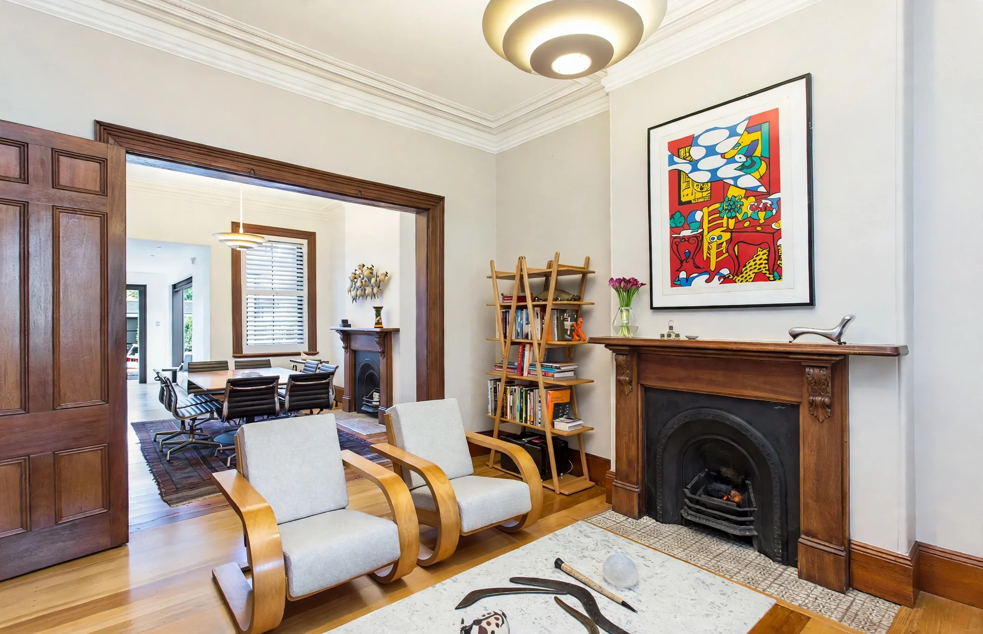 Living room with original fireplace, bay window and built-in bookshelf, heritage terrace renovation