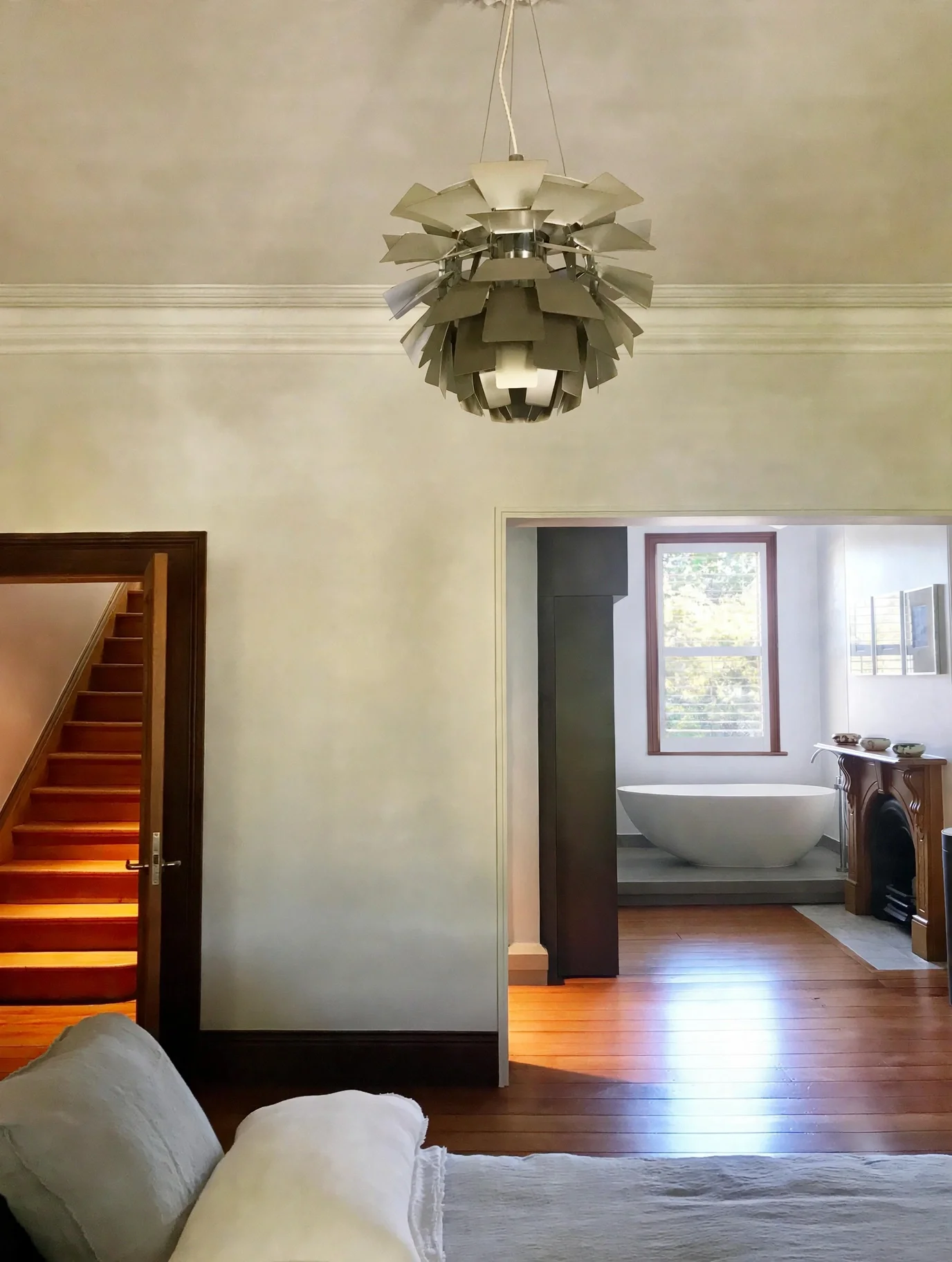 Entry hallway with pendant light opening to ensuite bathroom, Erskineville Victorian terrace renovation