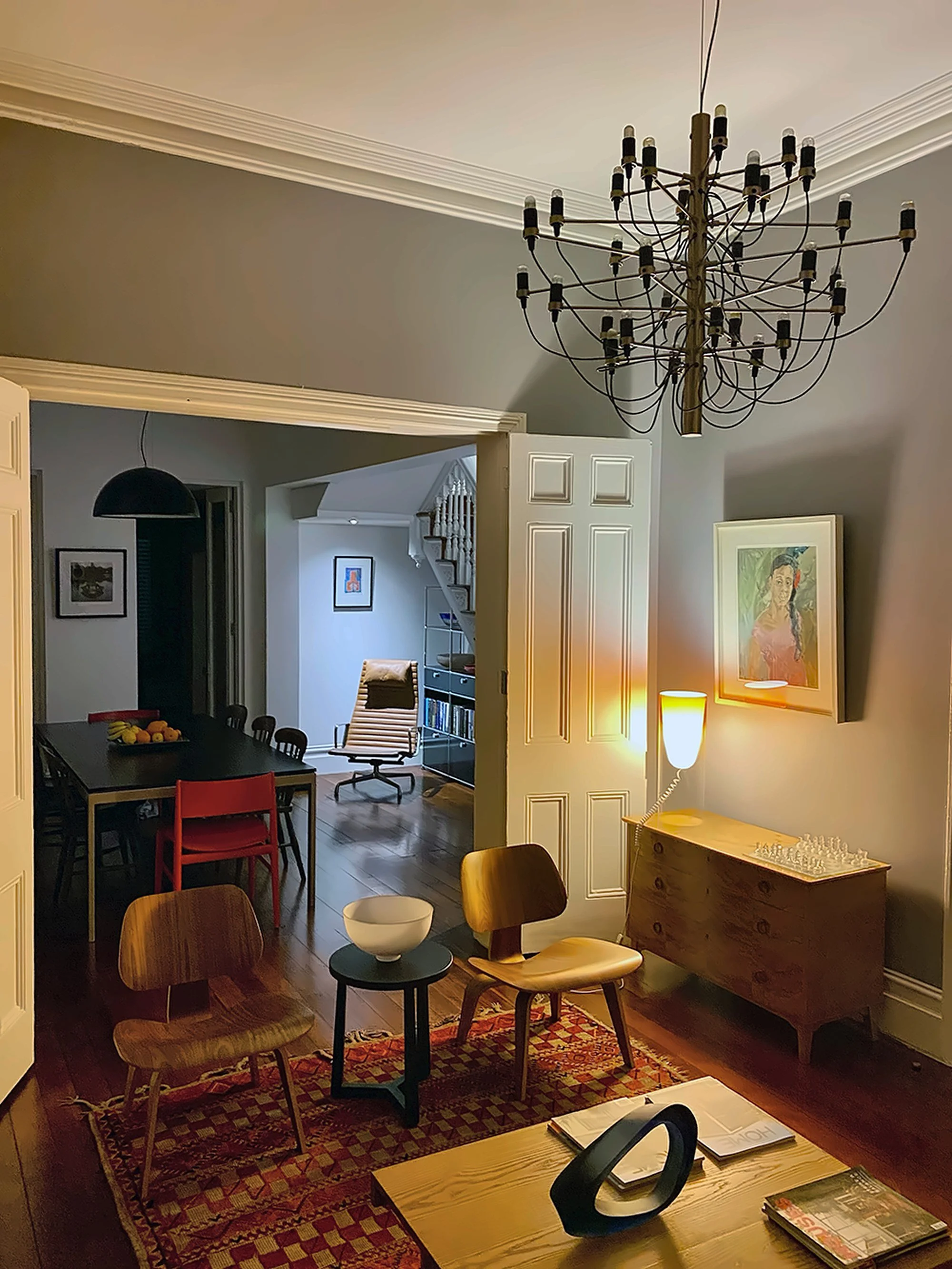 Living room and dining room of a Surry Hills terrace with a Flos chandelier, by A Studio Architecture
