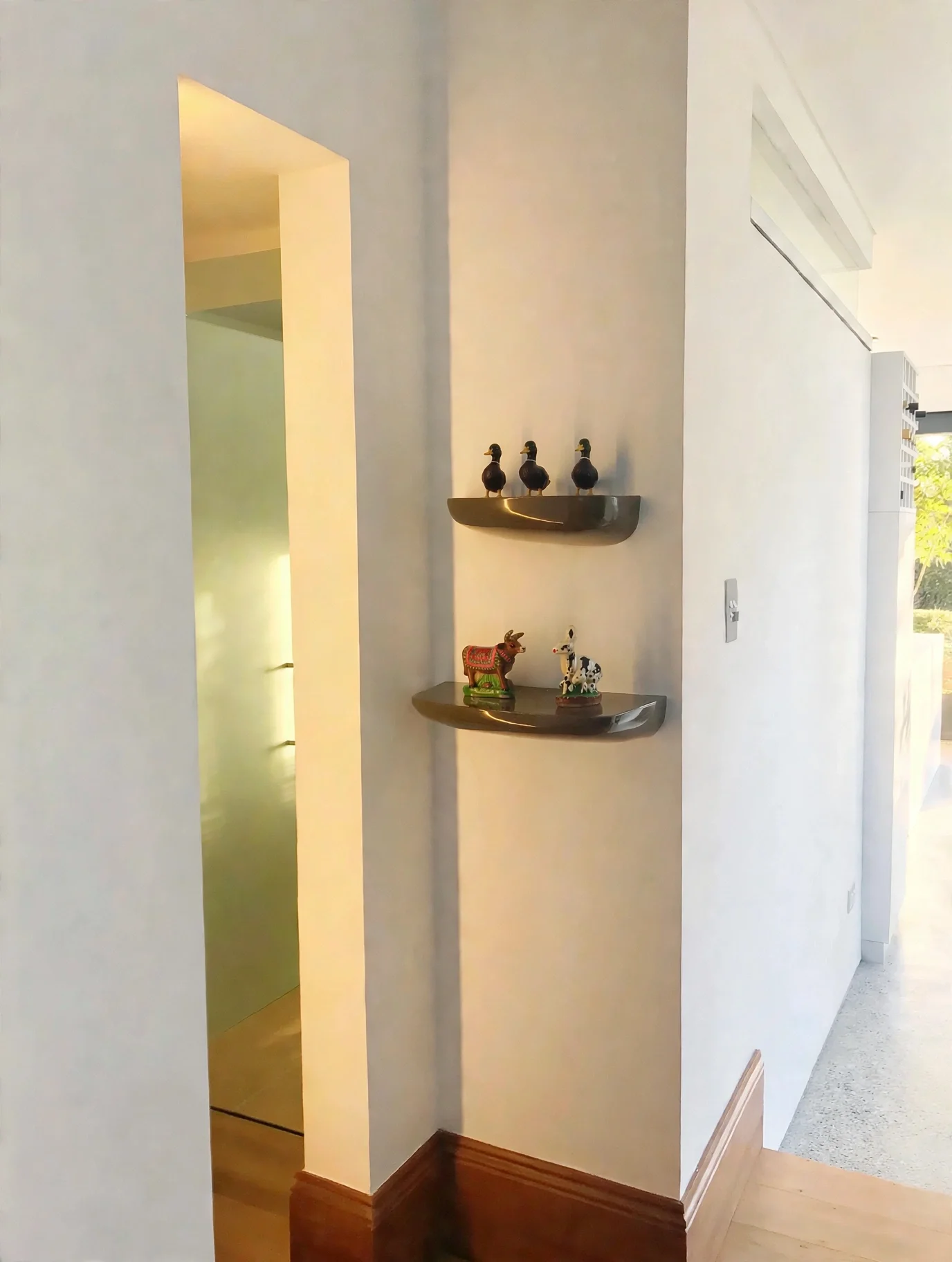 Floating steel display shelving in corridor, custom joinery detail, Erskineville terrace renovation