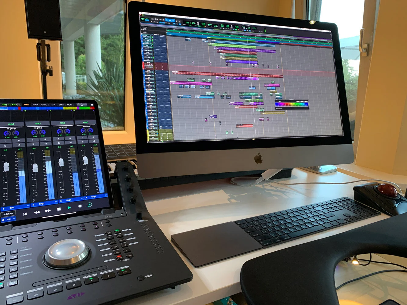 Music production setup with computer and audio control surface. Avid Pro Tools. Hashmoder (Omar Hash) (Omar Hashim)