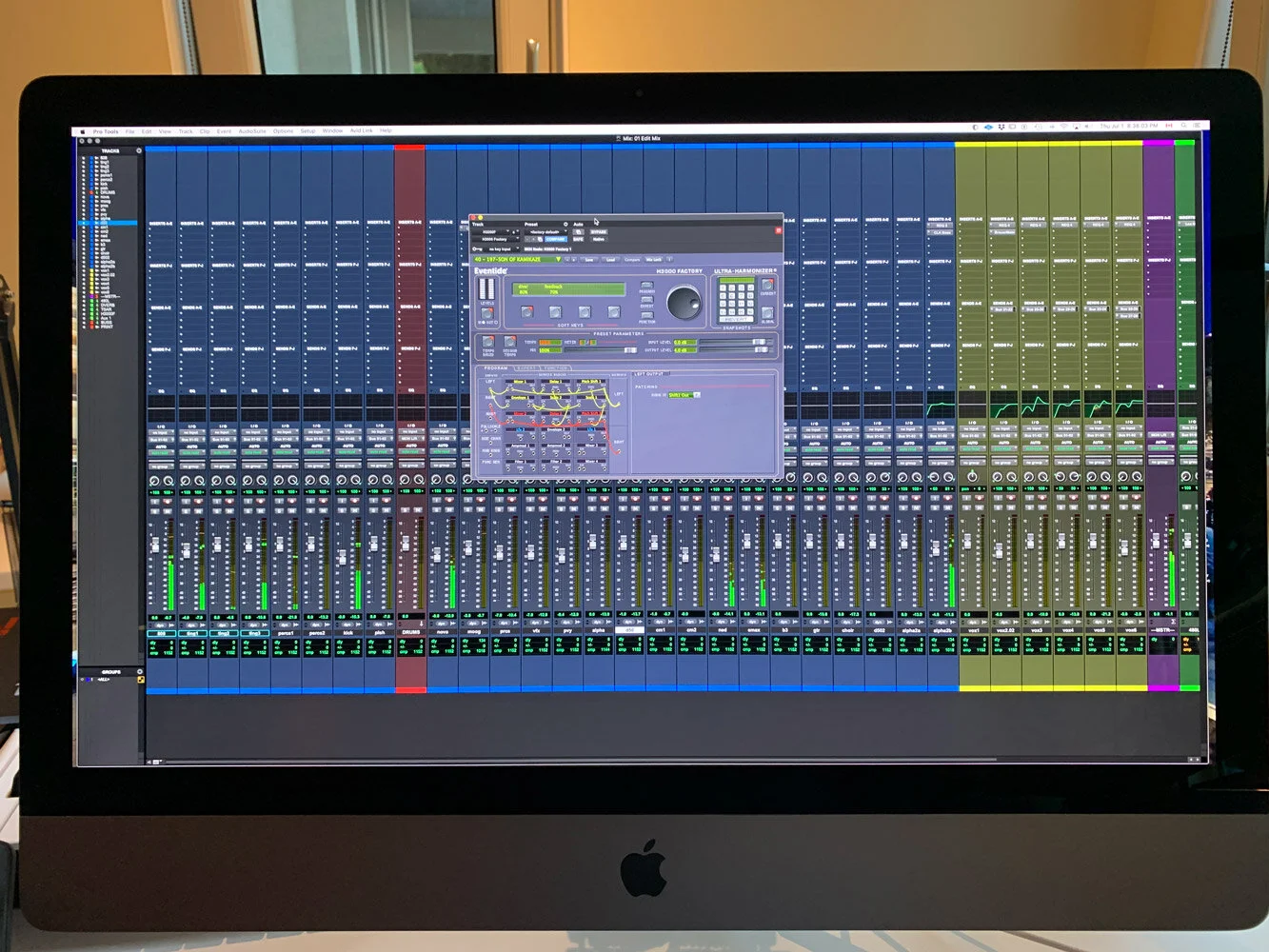 Audio mixing software interface on a computer screen showing multiple tracks, volume levels, and equalizer settings. Avid Pro Tools. Hashmoder (Omar Hash) (Omar Hashim)
