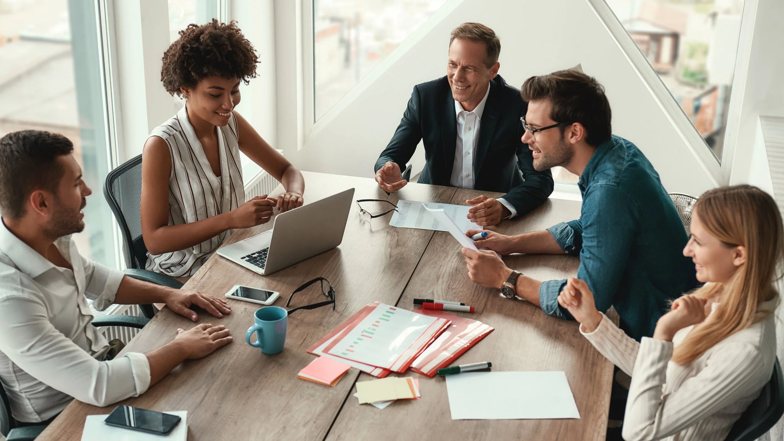 Group of team members strategizing at a table