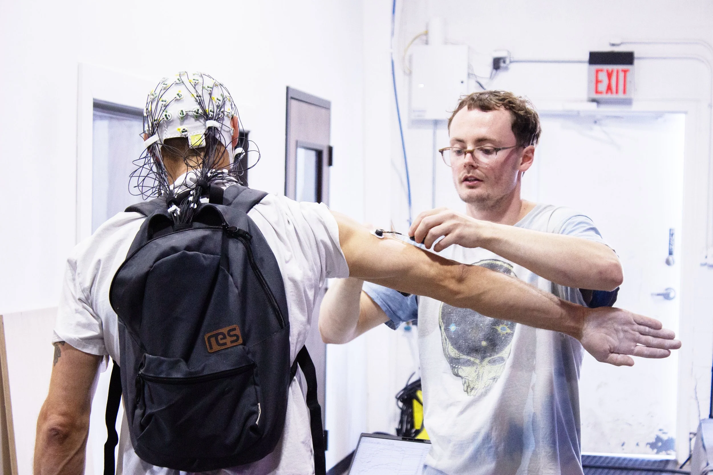 Carter Hartman (right) preparing a participant for data collection during a summer 2026 trip to Colorado.