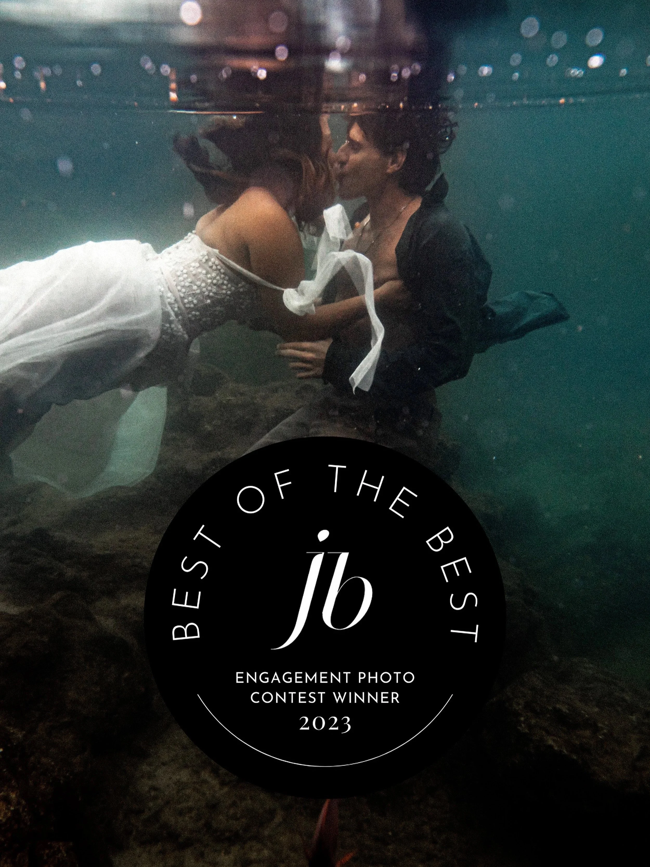Junebug best of the best award winning image of a couple kissing underwater on the north shore of Oahu Hawaii