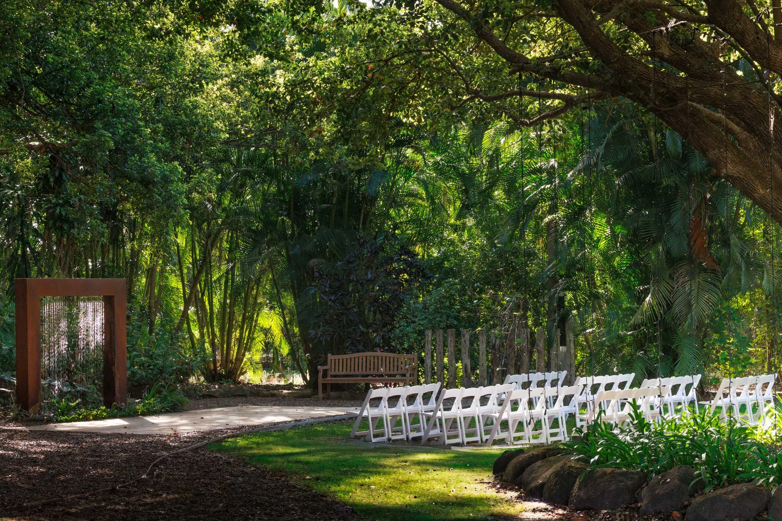 Corten-steel water-feature arbor ceremony location at In The Grove Bundaberg.