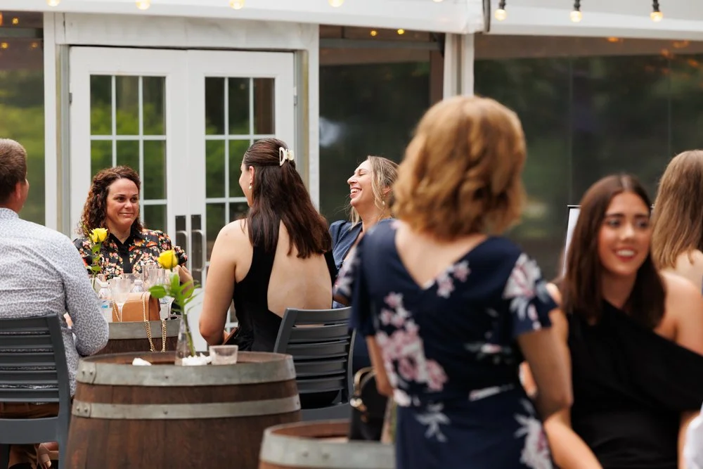 in-the-grove-wedding-guests-garden-cocktail-hour-laughing.jpg