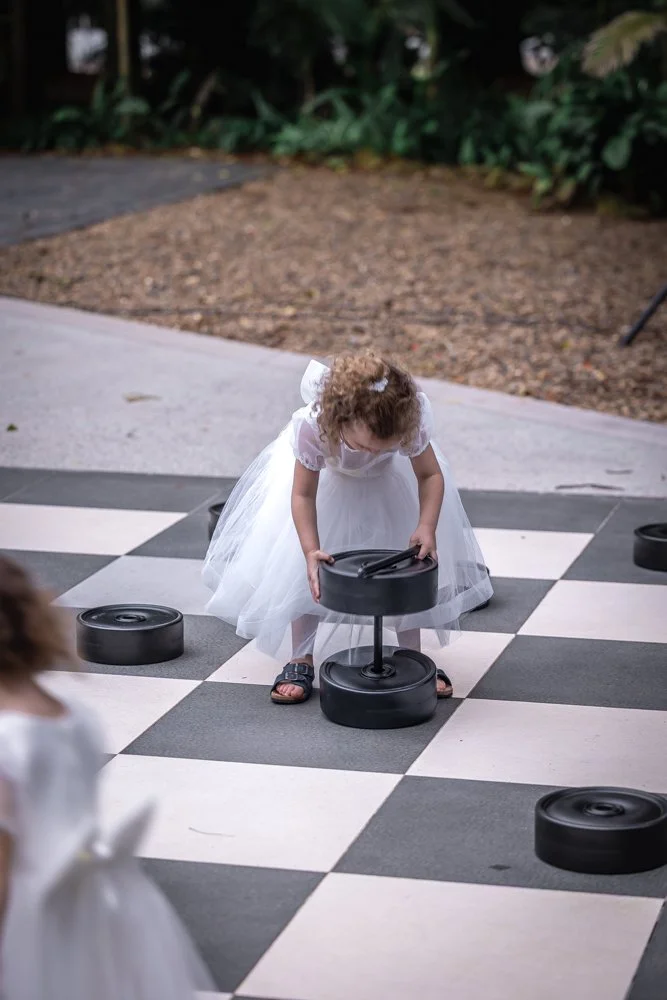 in-the-grove-garden-wedding-giant-checkers-kids-playing.jpg