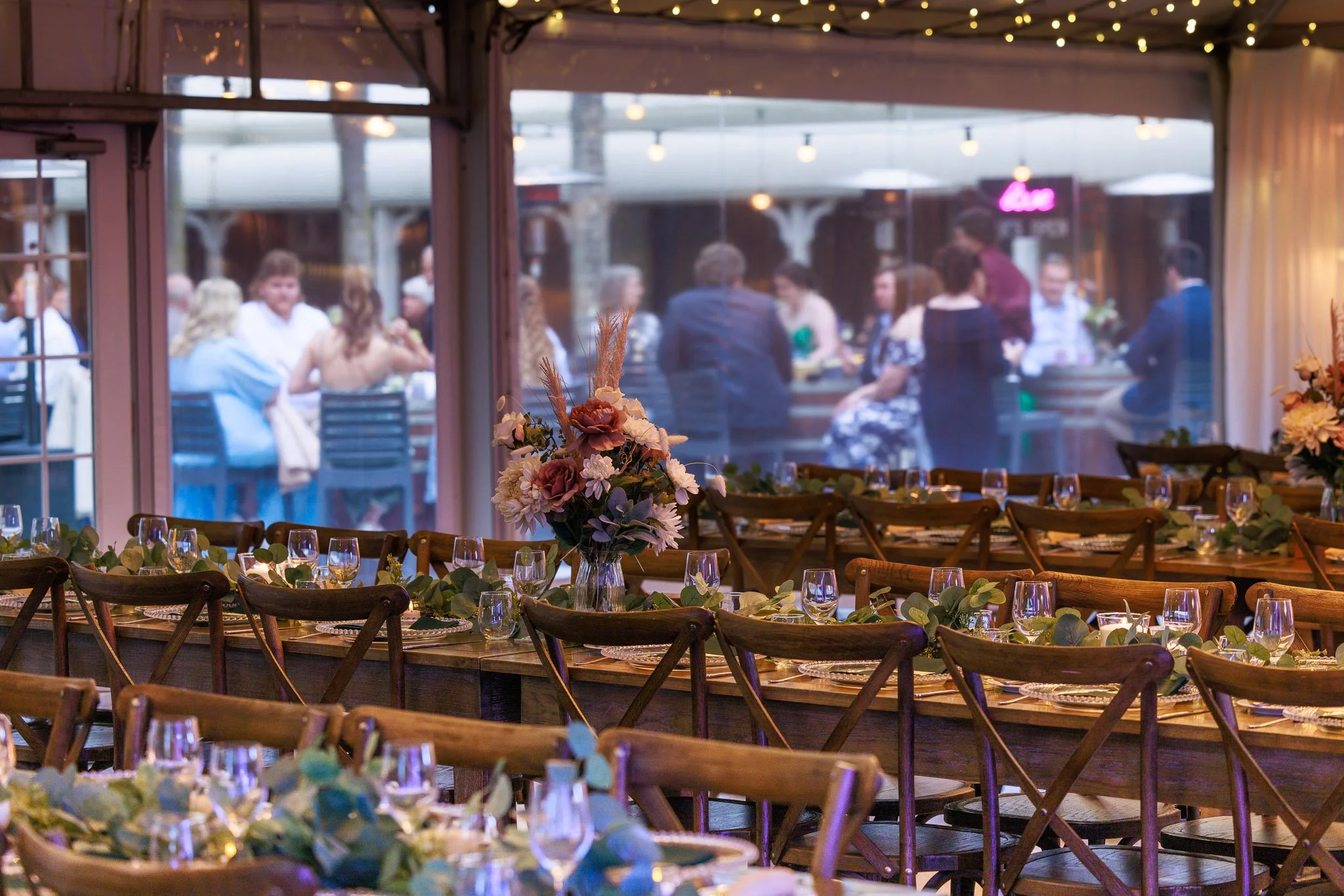 Elegant winter wedding reception at In The Grove Queensland with timber tables, warm lighting and ambient styling