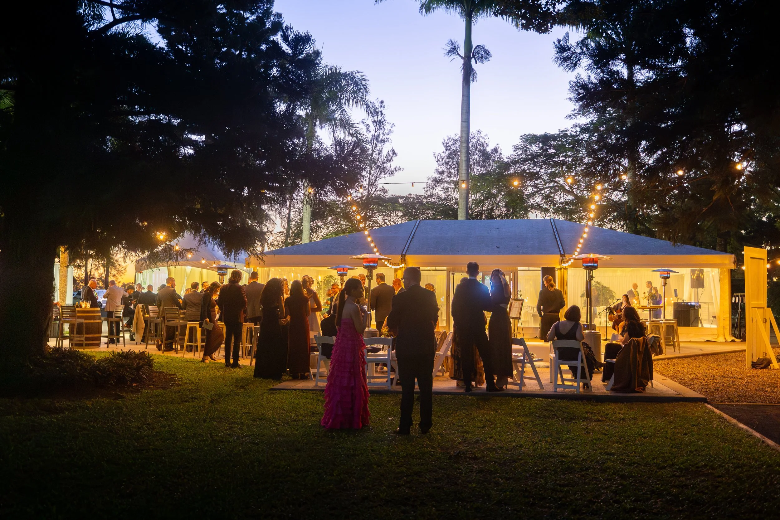 Guests enjoying the sunset while waiting to enter the marquee for the start of the evening celebrations