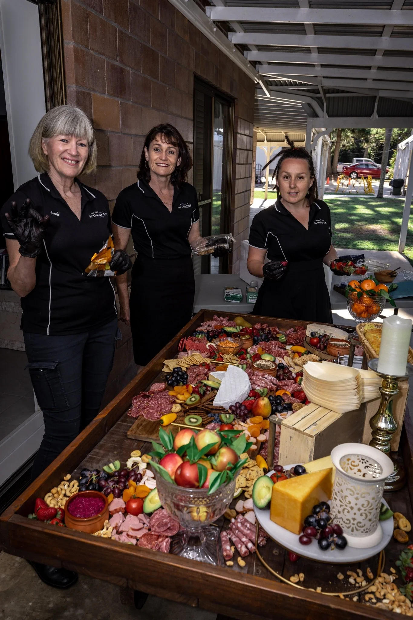 Premium grazing station with cheeses, meats and fresh produce styled by In the Grove staff for a wedding reception.
