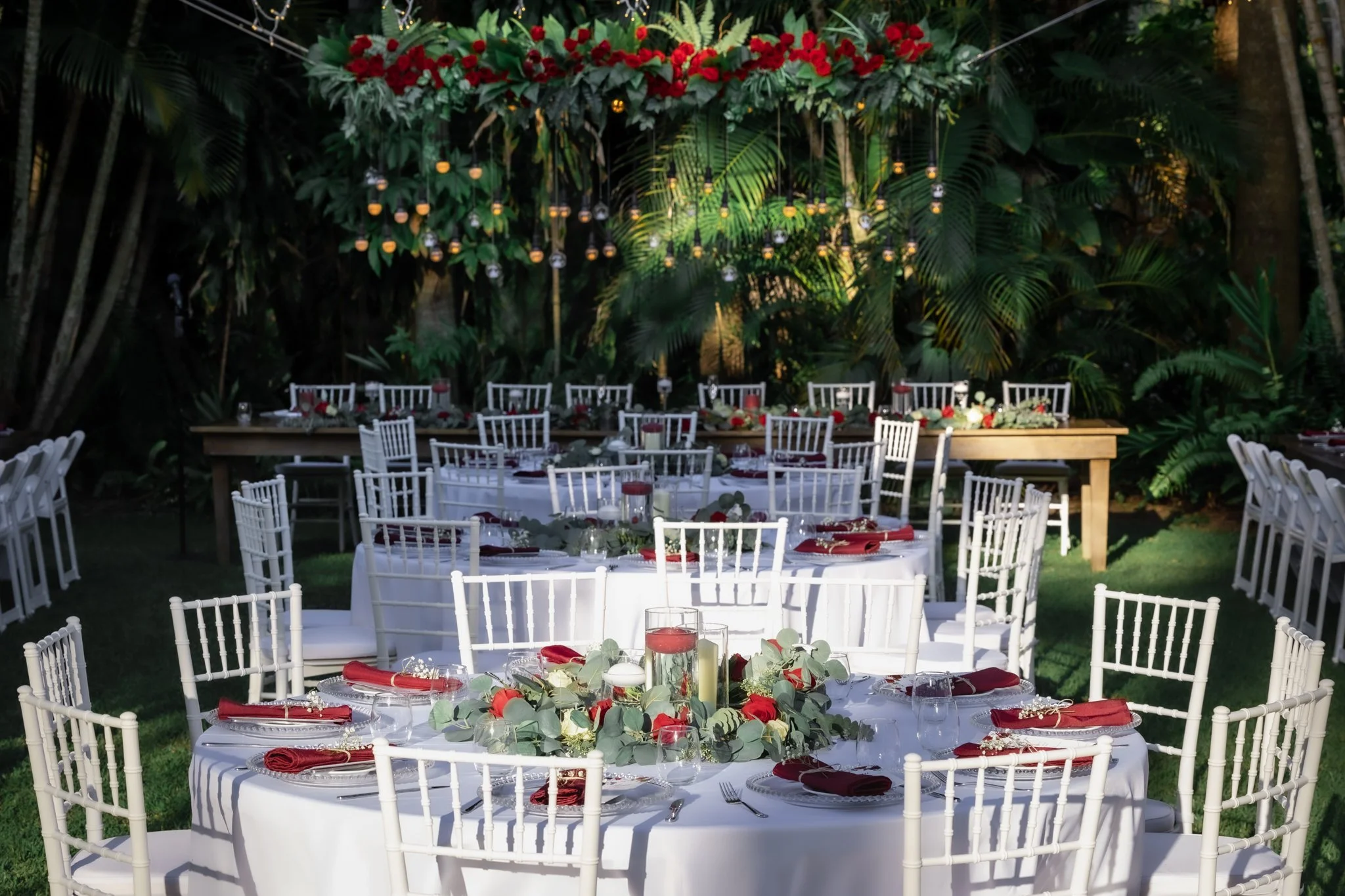 Elegant outdoor garden wedding reception at In The Grove Queensland with styled tables and lush tropical setting