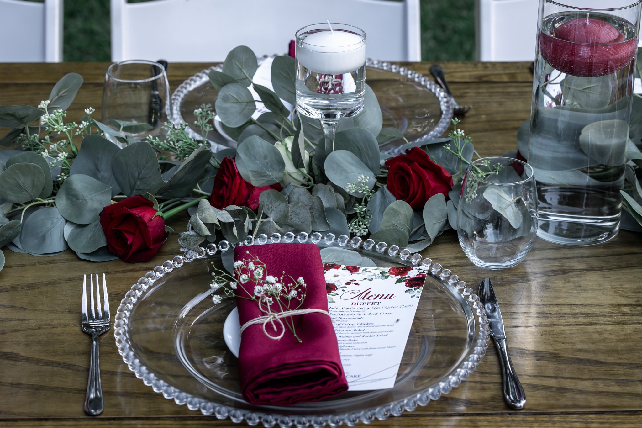 Personalised wedding place setting with name details and elegant styling elements for a refined guest experience.