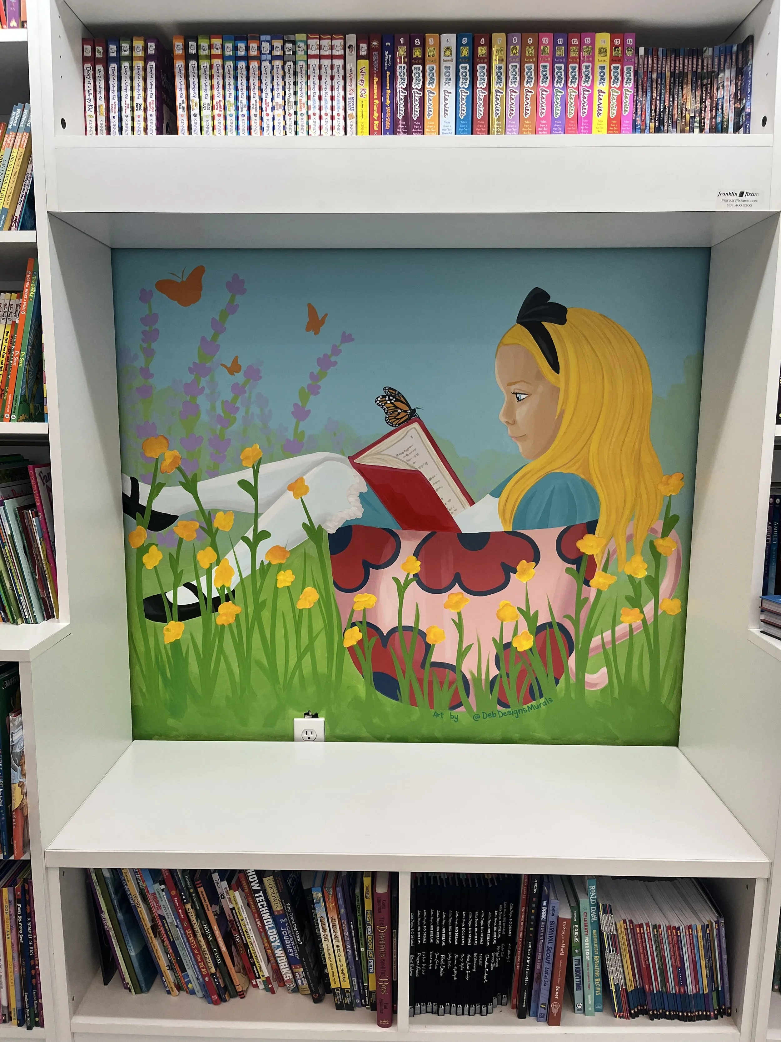 Alice in Wonderland themed mural in TBR Books and Tea on Highland Rd in Baton Rouge