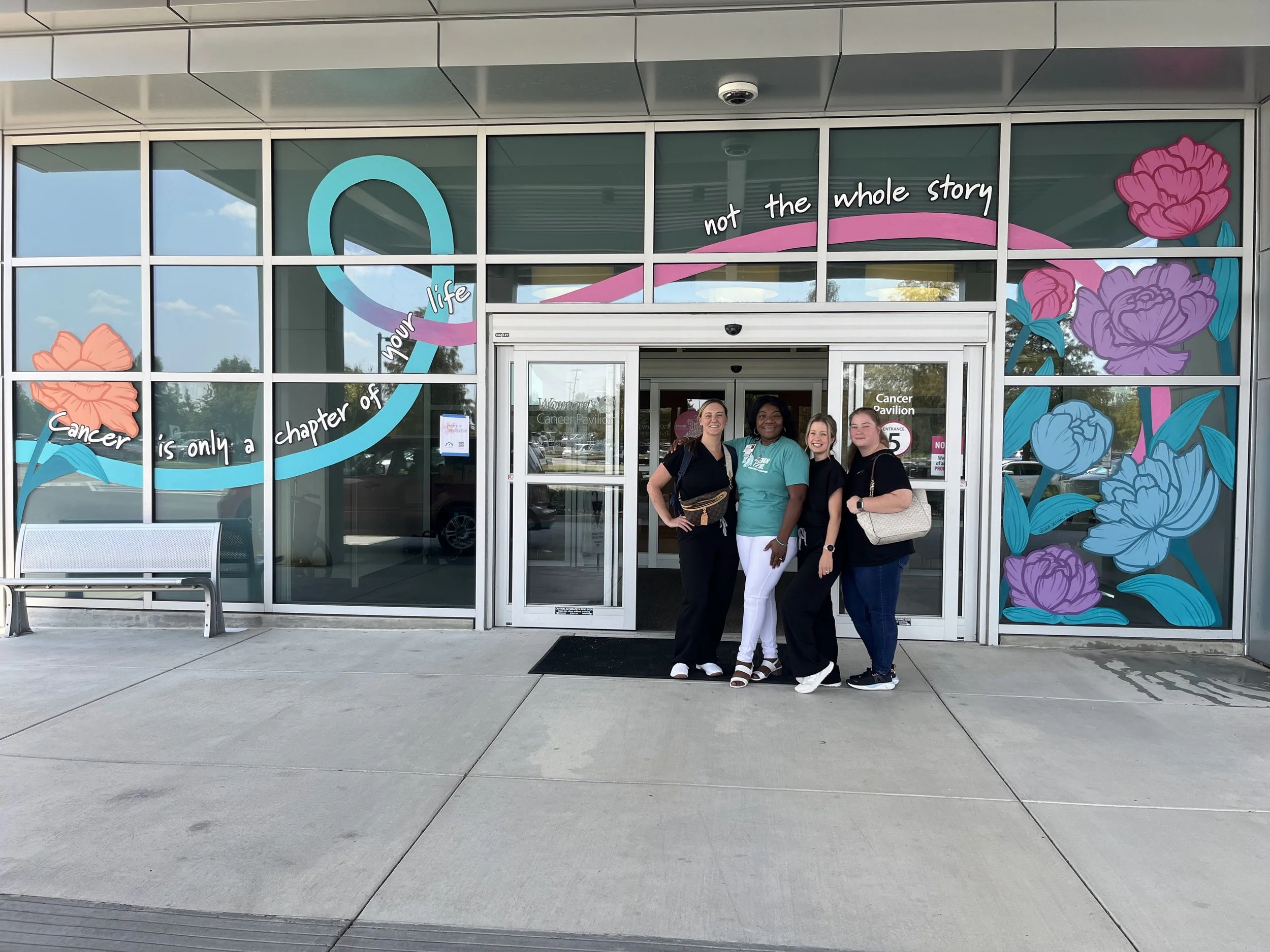 Woman’s Hospital front entrance window mural for Gynecological Cancer and Breast Cancer awareness months (September and October)