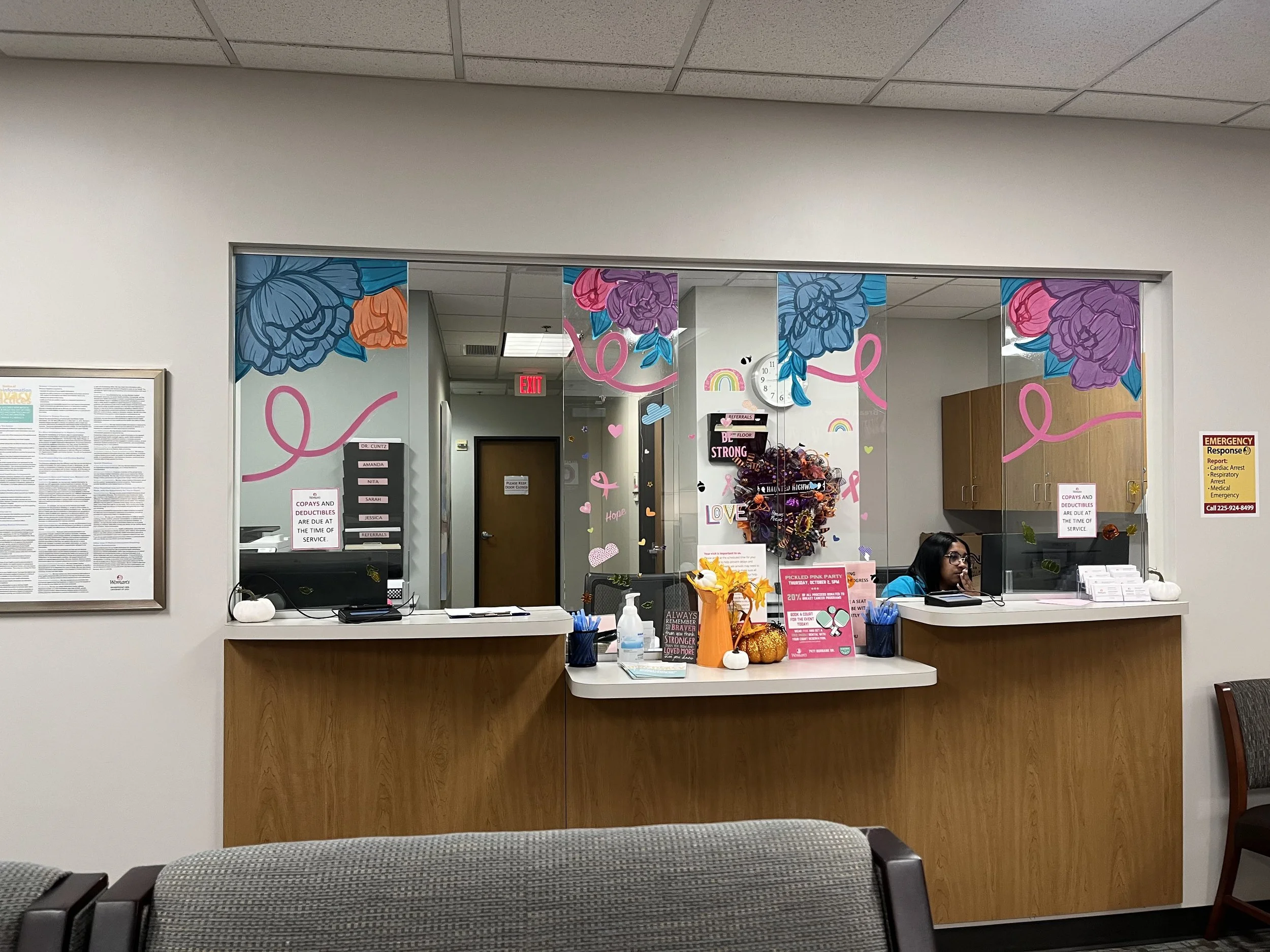 Interior window mural for breast cancer awareness month at Woman’s Hospital. Painted on removal vinyl clings