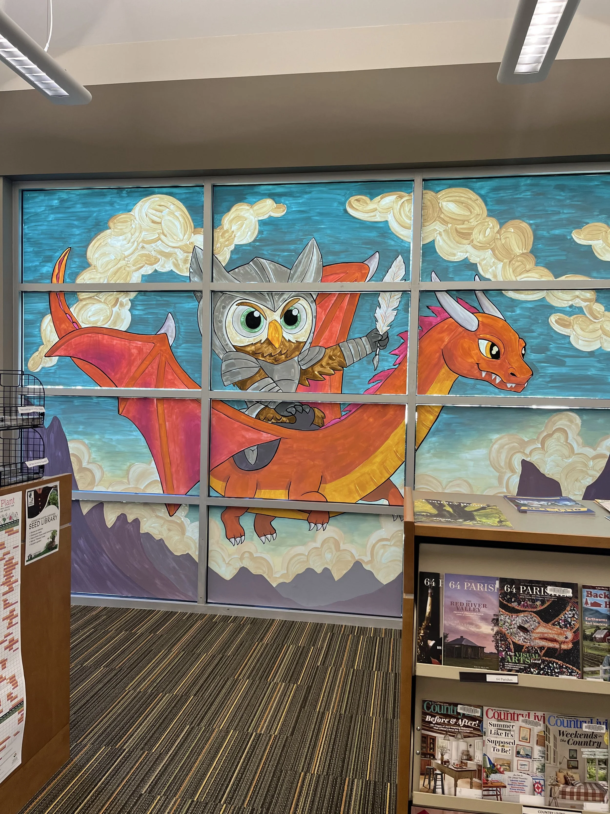 Second window mural for Livingston Parish Library’s Annual Book Festival. Medieval knight and dragon themed mural painted on vinyl cling
